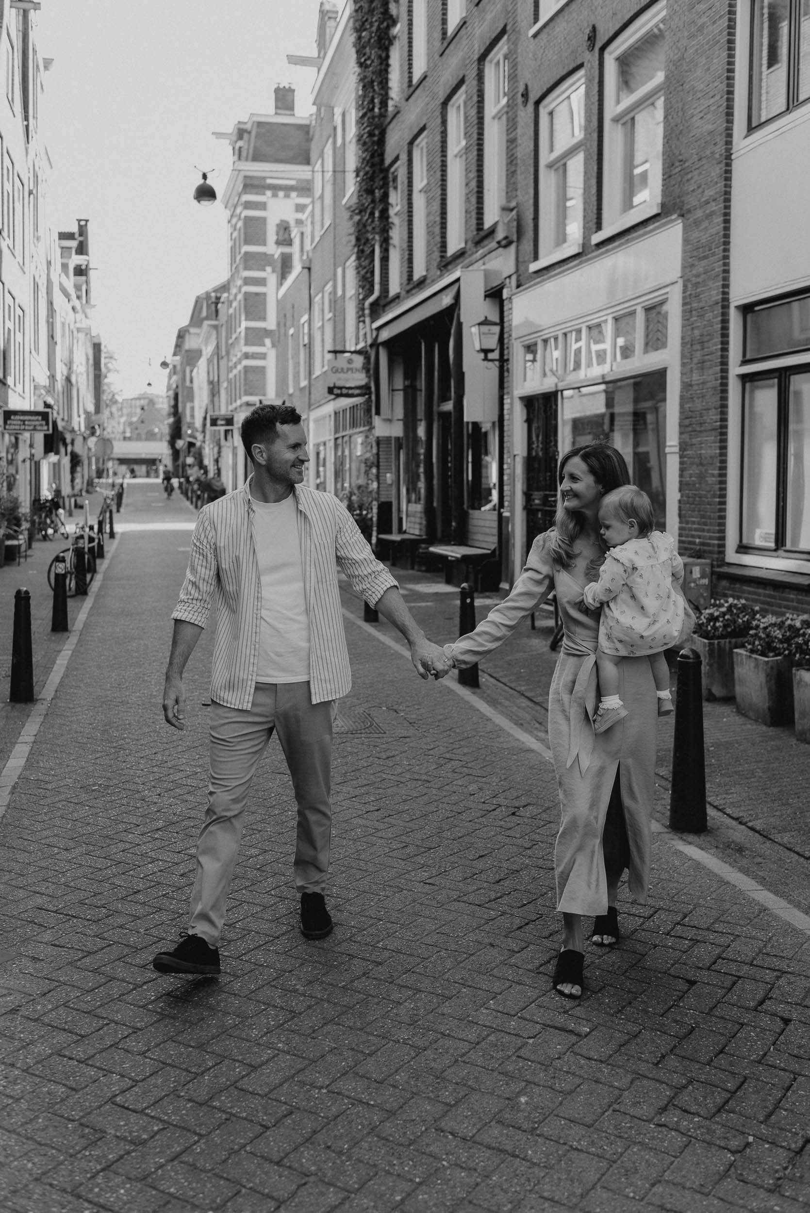 Couple walking down a street in Amsterdam | Vicky McLachlan Photography