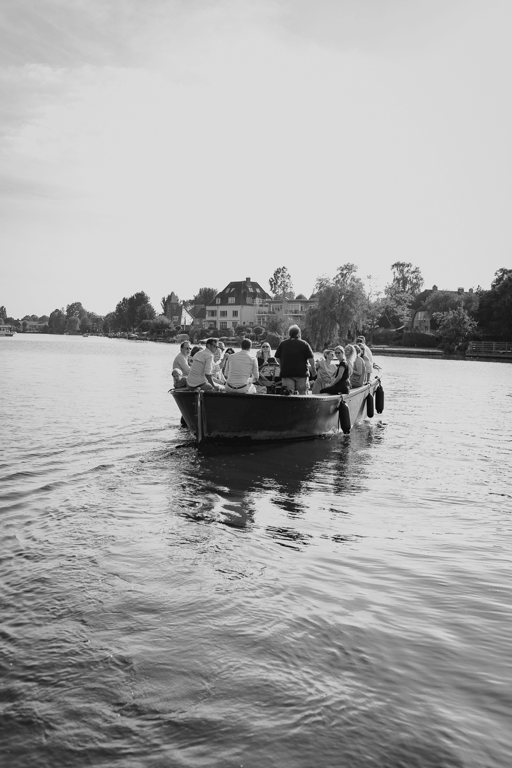 Small Wedding in Haarlem by Vicky McLachlan Photography_Wedding party on a boat on the canal in Haarlem.png