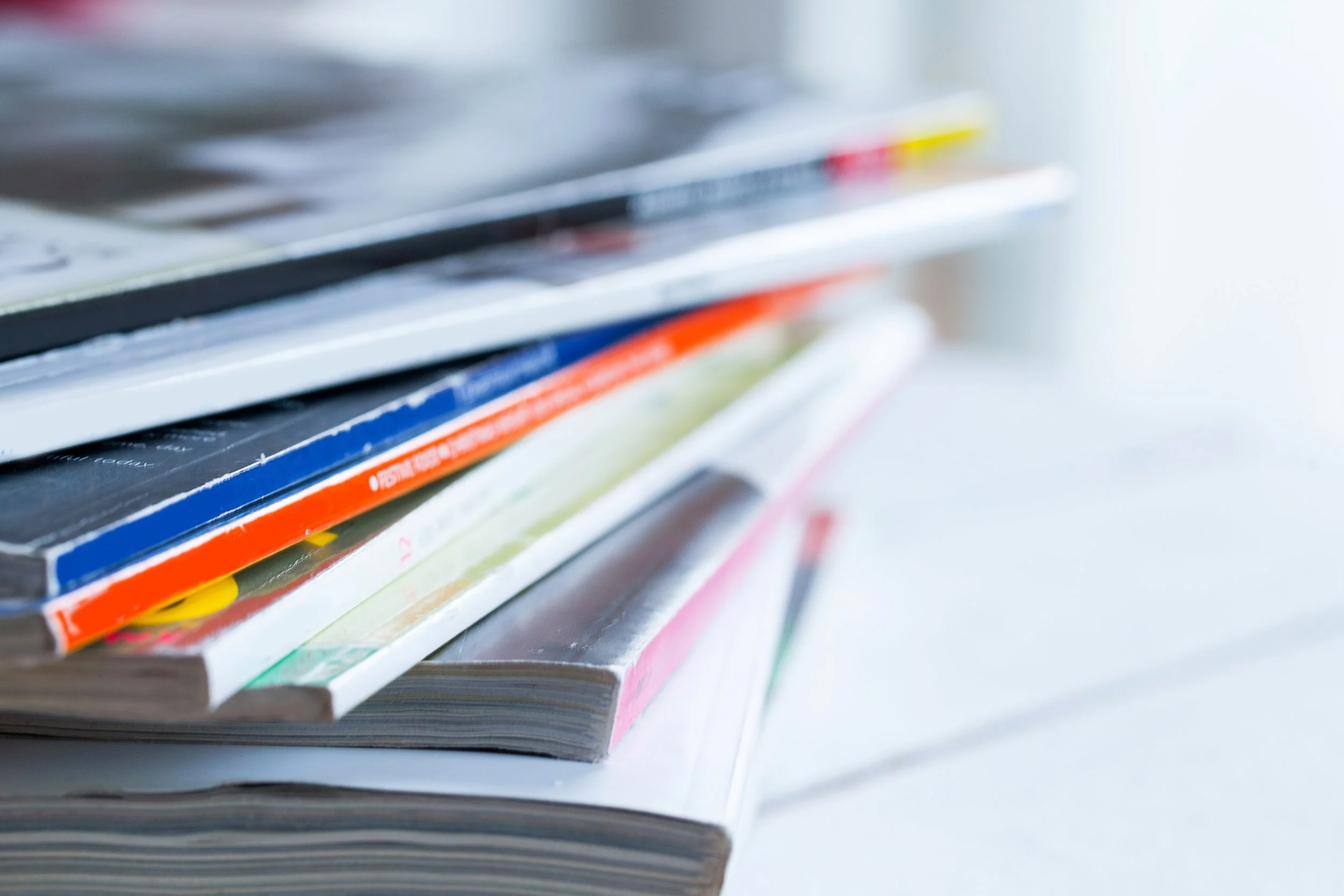 pile-colorful-magazines-table.jpg
