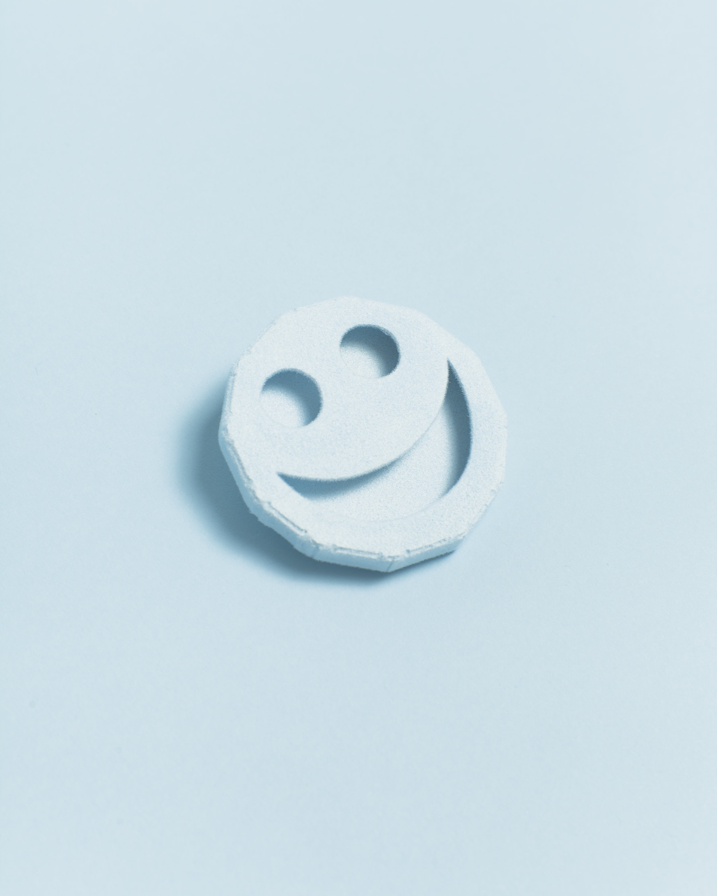   Fuzzy Smile Symbol Pin   Brass, Nickel, Paint, Flocking  2”x2”x.5”  (Baby Blue, Light Grey)    Photo by Harry Gould Harvey 