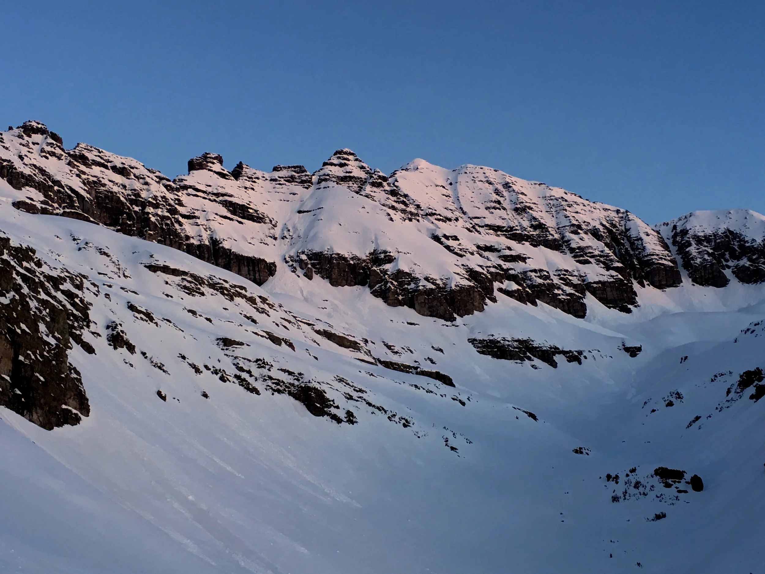 A good view of the summit caked in snow up high, but also notice all the previous wet slide activity.  