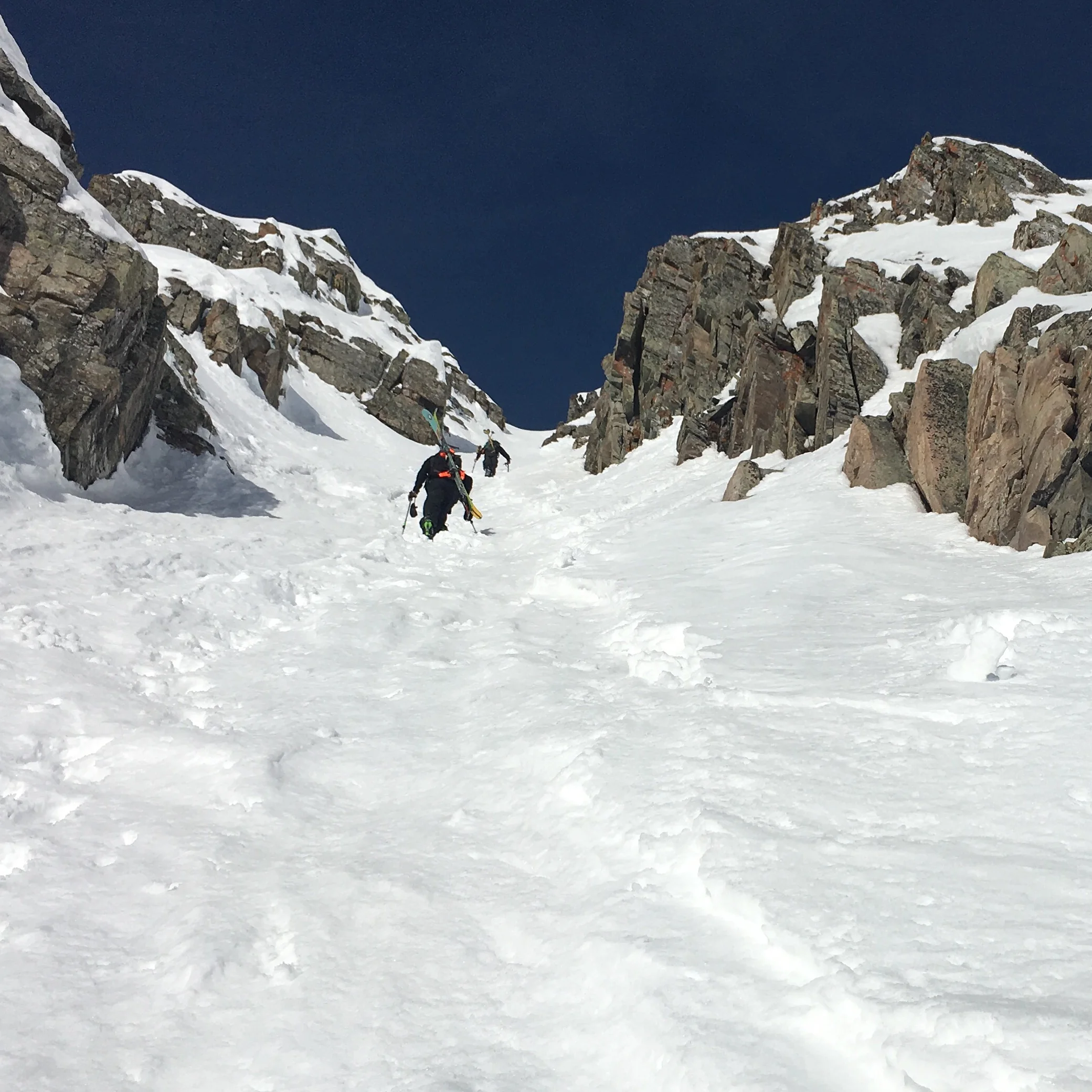 Hiking up a couloir its starting to get extermely got. We are trying to move fast to get to the top. 