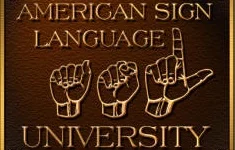 ID: American Sign Language University Logo: A bronze plaque looking logo with text on the top “American Sign Language” Below the text, three of ASL’s handshapes ‘A’, ‘S’, and ‘L’. At the bottom of the logo, text “University”