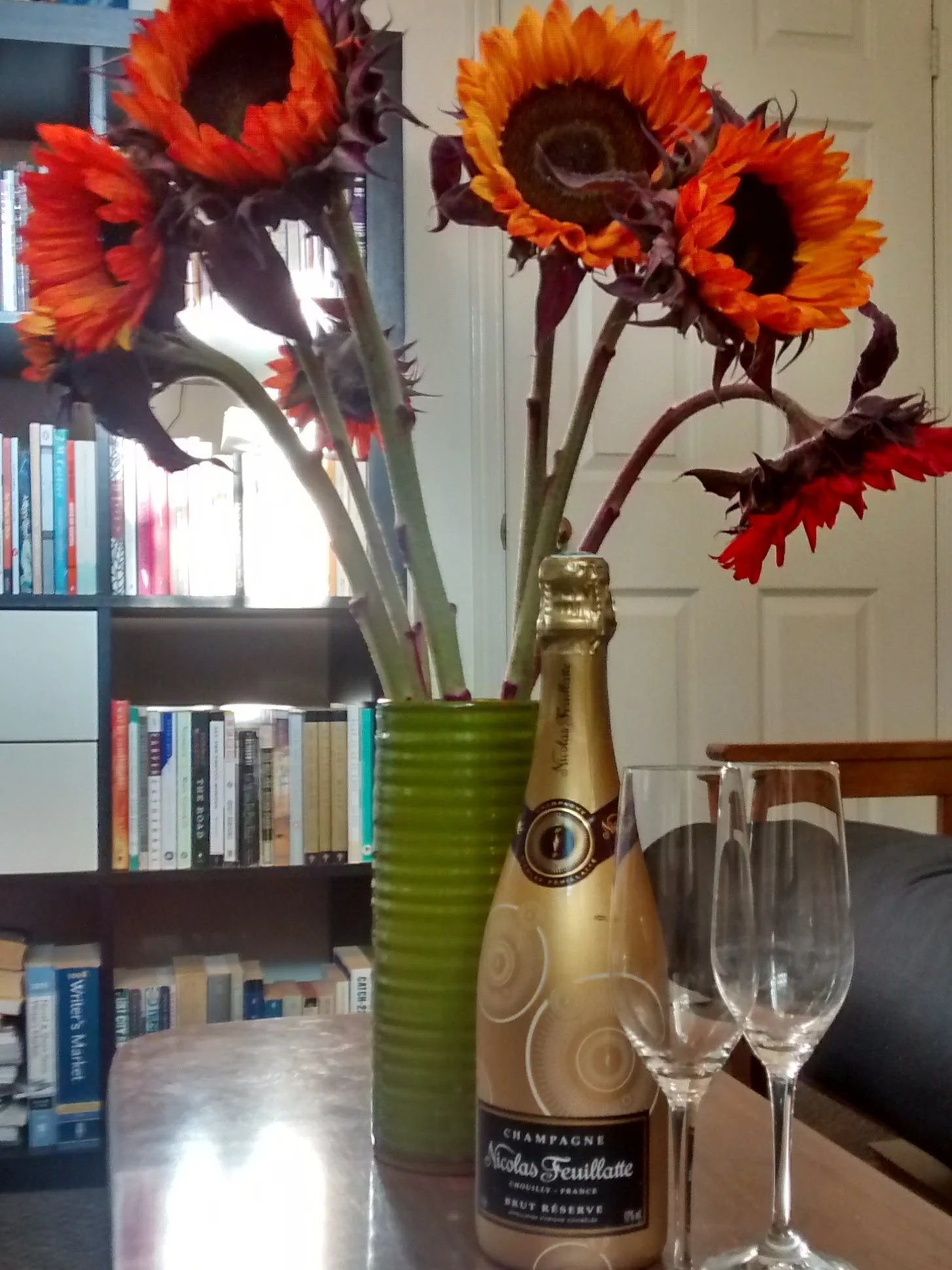 Celebrating beside my bookshelf!