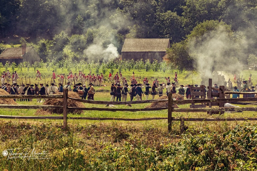 Reenactors massed on the field during battle, Old Sturbridge Village