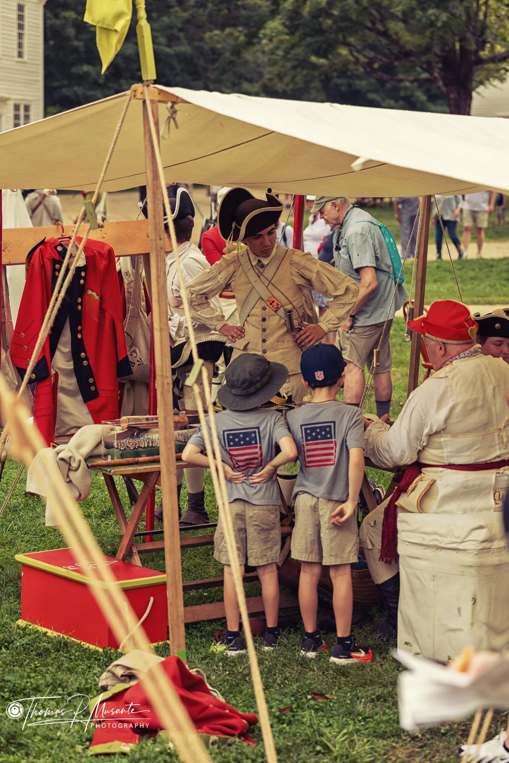 Boys in Stars-and-Stripes T-Shirts Meeting an Interpreter