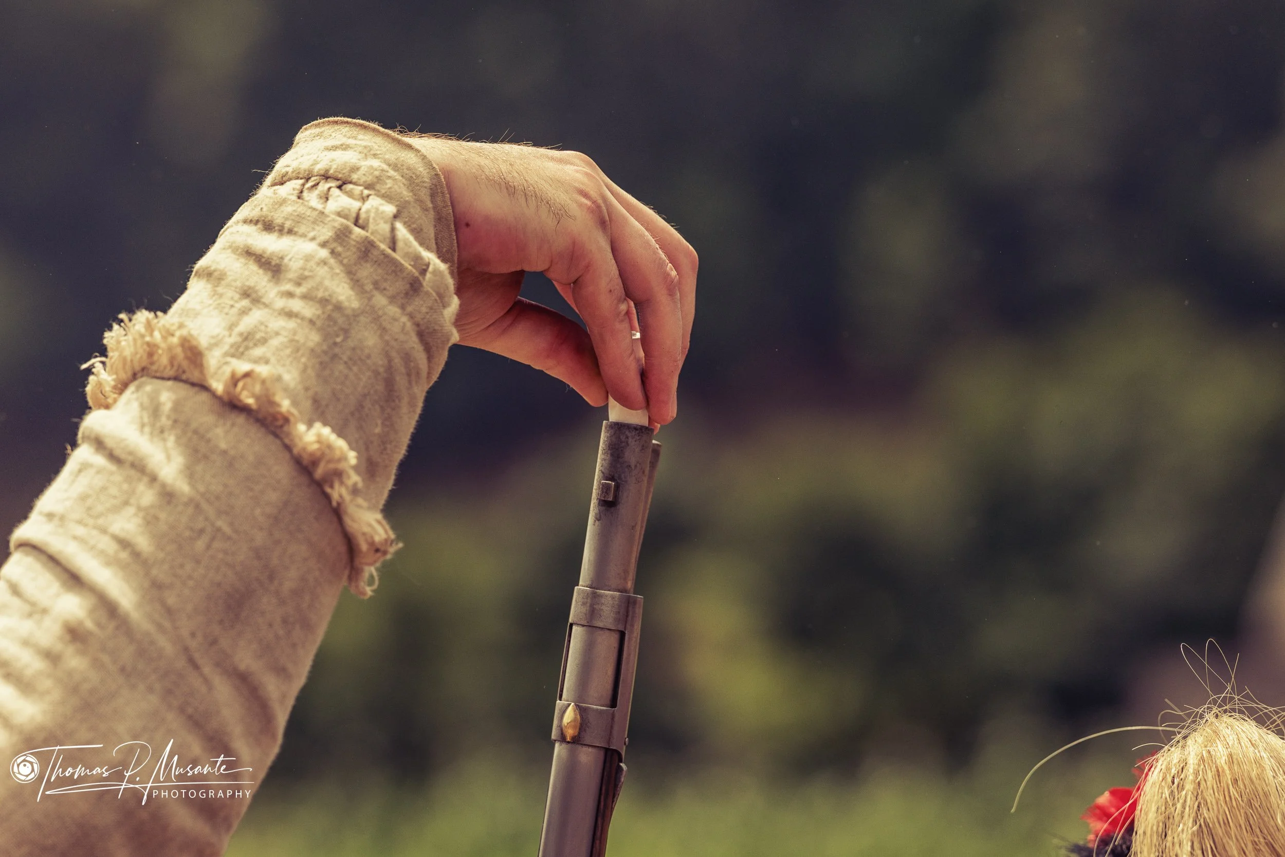 Starting a Paper Cartridge into a Flintlock Muzzle