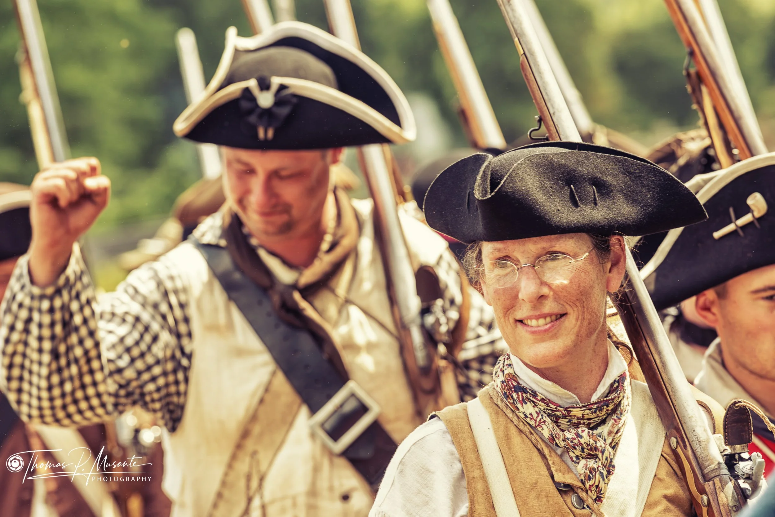 A Smile in the Ranks: Reenactors on the March with Shouldered Flintlocks