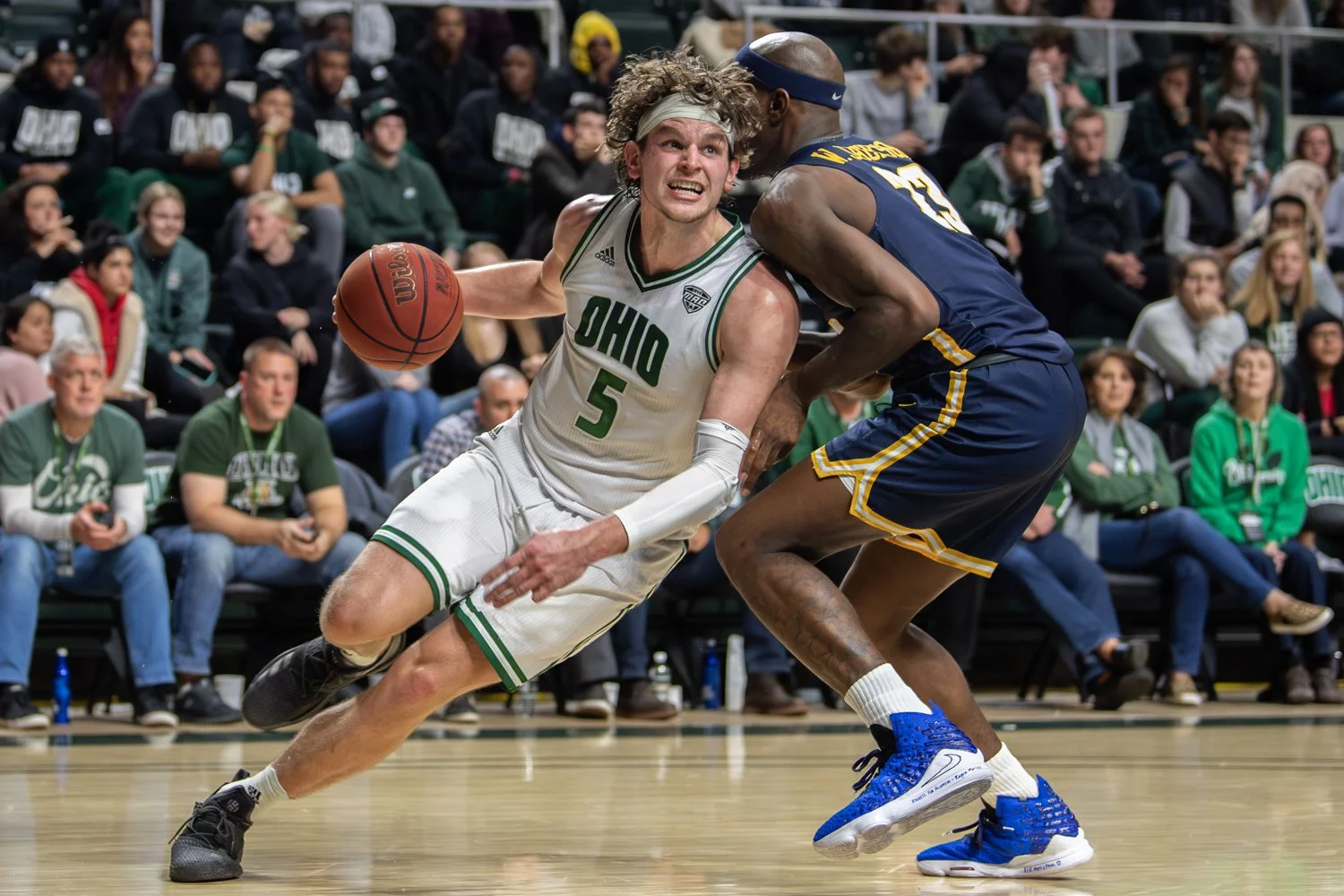  Ohio's Ben Vander Plas drives past Toledo's Willie Jackson during the Bobcats' game against Toledo on Jan. 21, 2020, at the Convocation Center in Athens, Ohio. Ohio lost the match 83-74. 