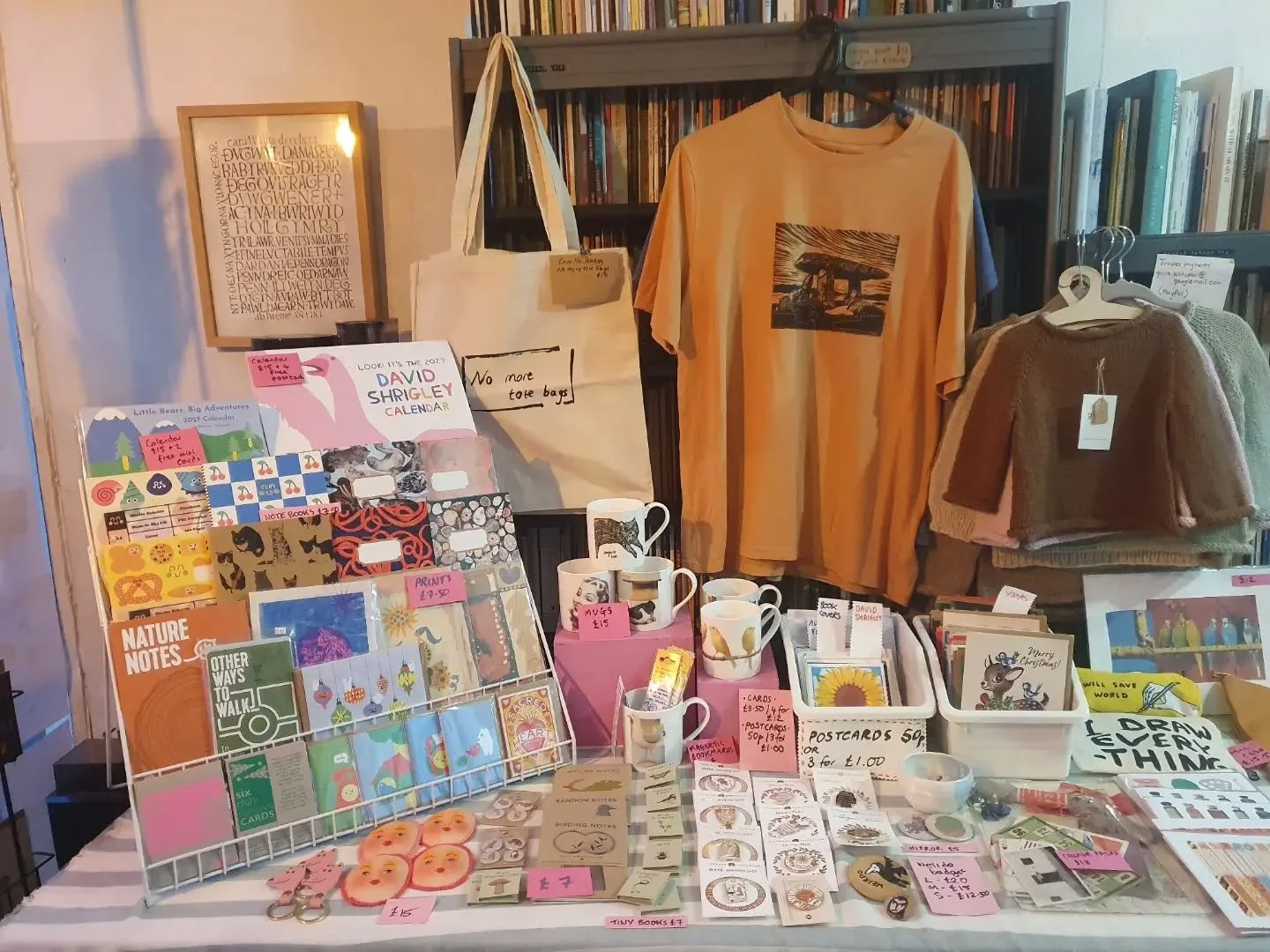 All set up ready to open tomorrow at 10am. It took the Shopkeeper her usual excessive number of hours to organise one table, but we hope you agree it's worth it.

Calendars, cards, notebooks, prints, tote bags,  t shirts, mugs, magnetic bookmarks, sp