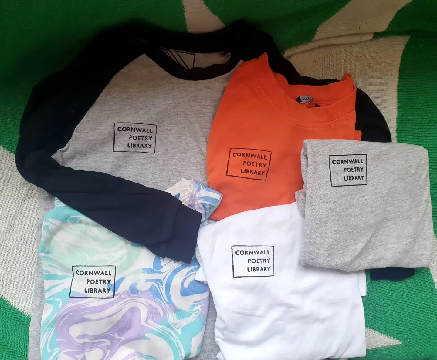 Normally @cornwallpoetrylibrary houses the Shoppery in its teeny tiny form, within the library window, and the monthly Popuppery. 

The Shopkeeper thought it was time to share some library love, so here are some of the kids size CPL t-shirts you can 