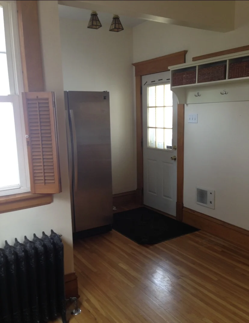 The original exterior door was relocated and the area just beyond this space was enclosed to accommodate the new mudroom.