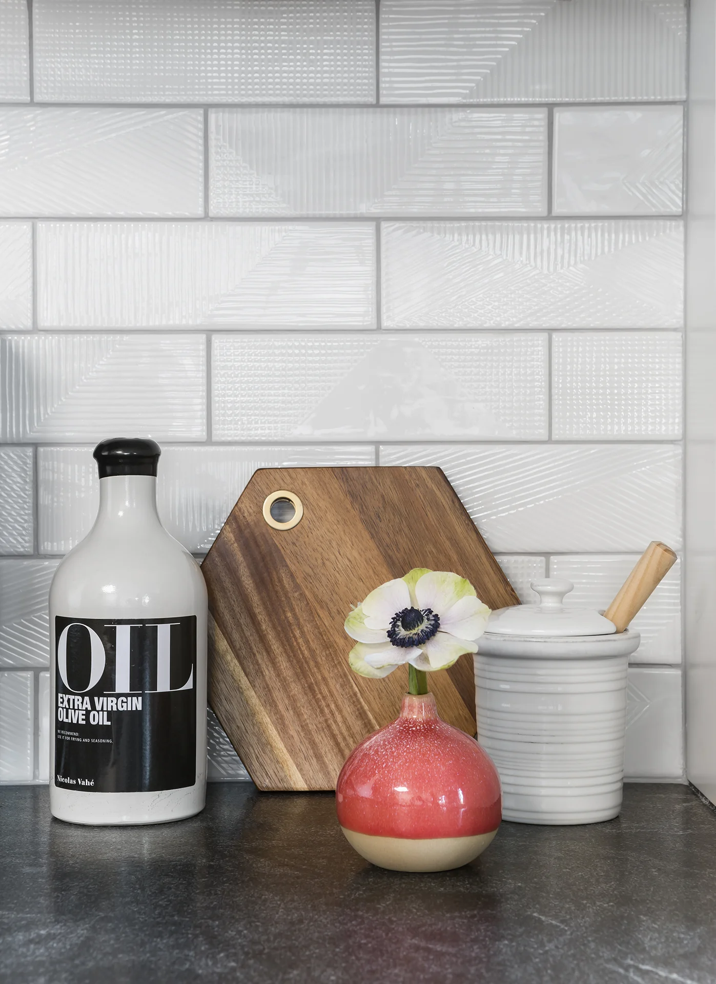 A closer look reveals the unique texture and design of the backsplash tile.