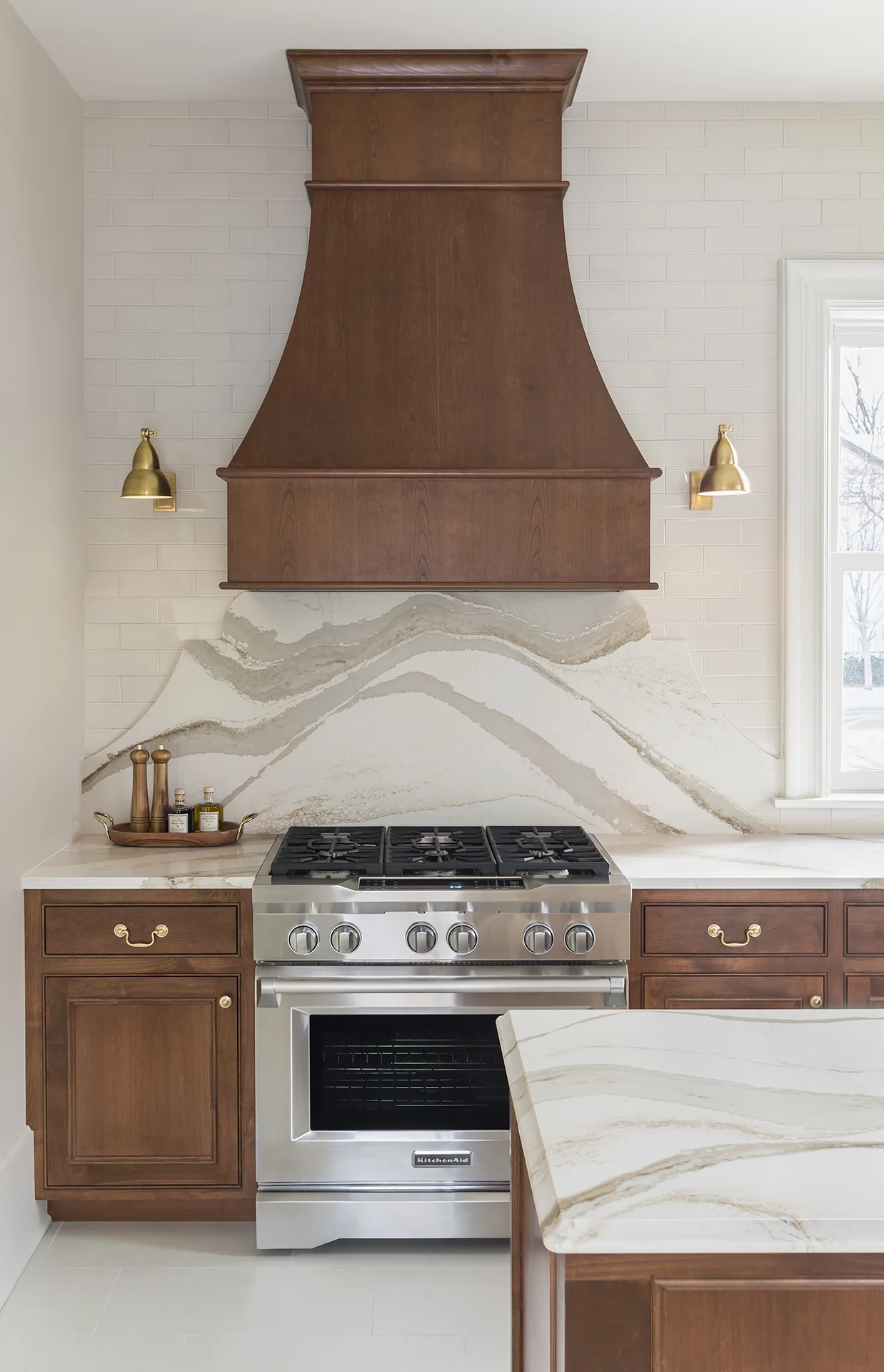Traditional details such as inset doors with a beaded frame blend with more contemporary elements to create a kitchen that feels classic, unique, and unexpected all at the same time.