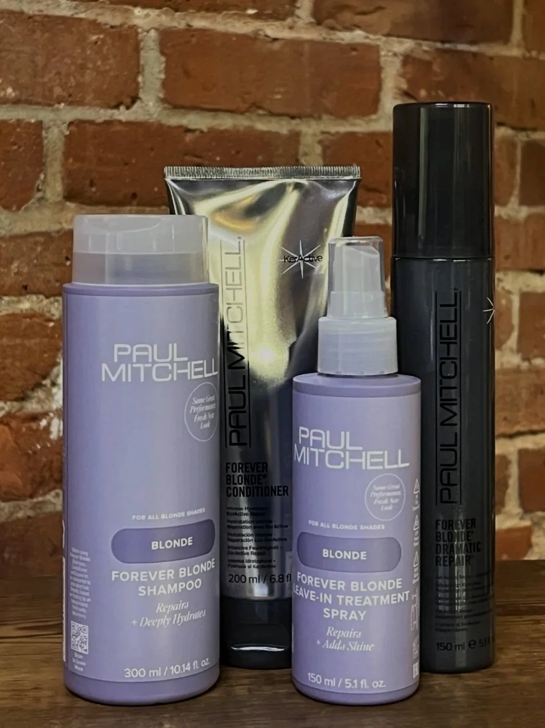 Paul Mitchell  Forever Blonde 
Forever Blonde is formulated specifically to protect and strengthen lightened or highlighted hair. KerActive protein technology helps repair damage while maintaining softness and brightness. Ideal for blondes needing hy