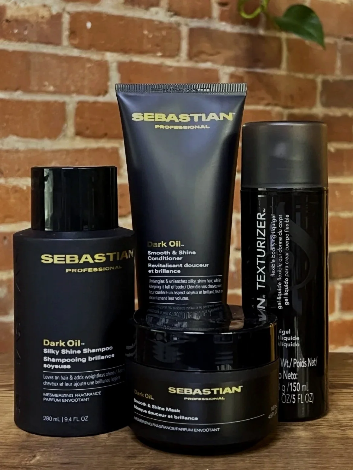 Sebastian Professional Dark Oil 
Dark Oil delivers lightweight smoothness with incredible shine and movement. Infused with sandalwood, cedarwood, and argan oils, it softens hair without weighing it down. Perfect for sleek finishes and touchable styli