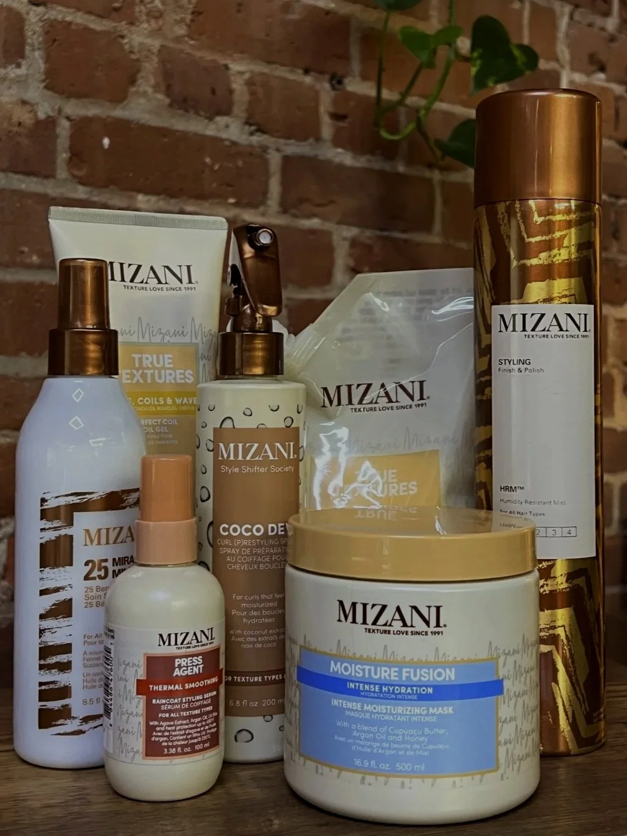 Mizani 
Mizani specializes in textured, curly, and coily hair care with professional performance formulas. The line strengthens, hydrates, and enhances natural texture while promoting scalp health. Designed to celebrate and support all curl patterns.