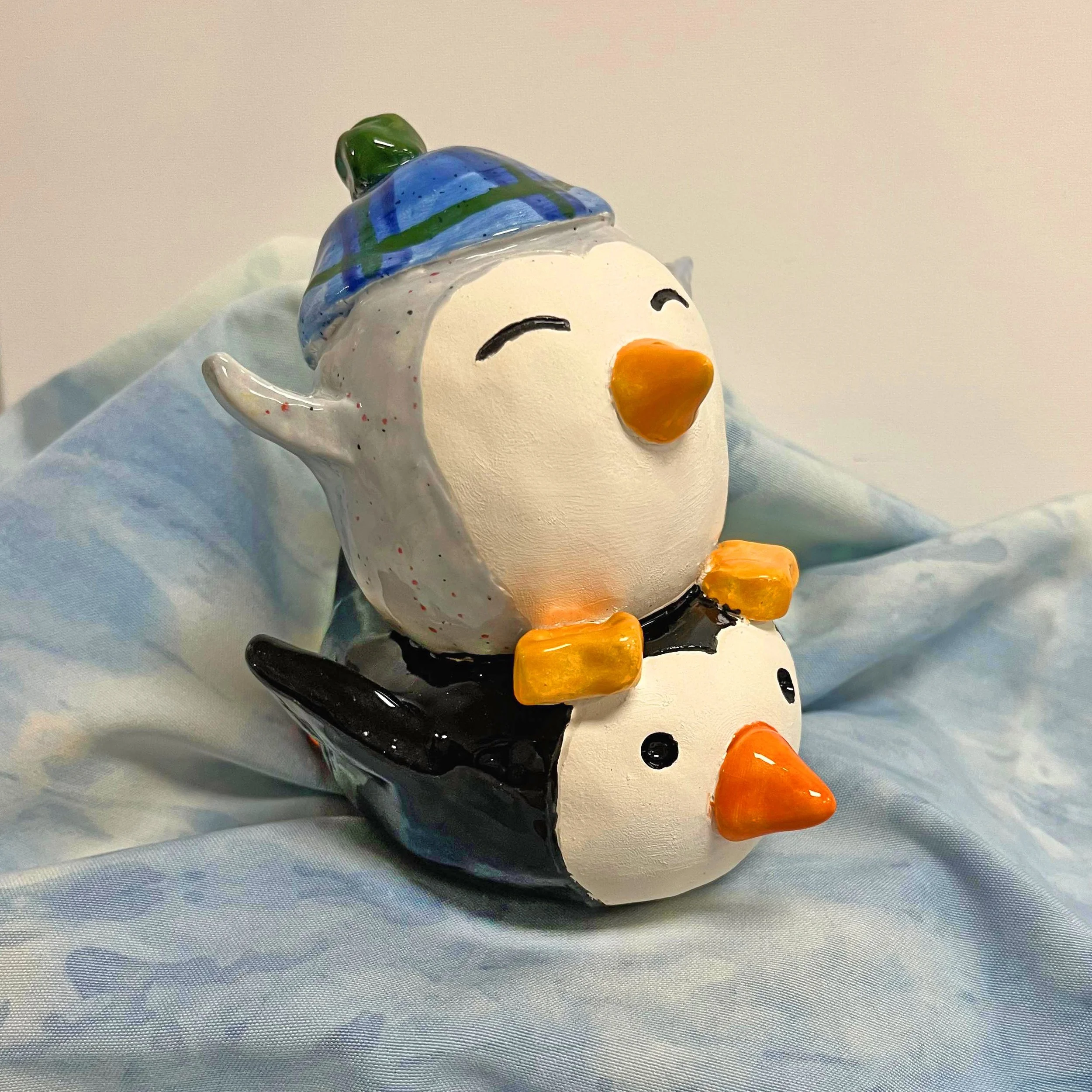 sledding penguins.jpeg