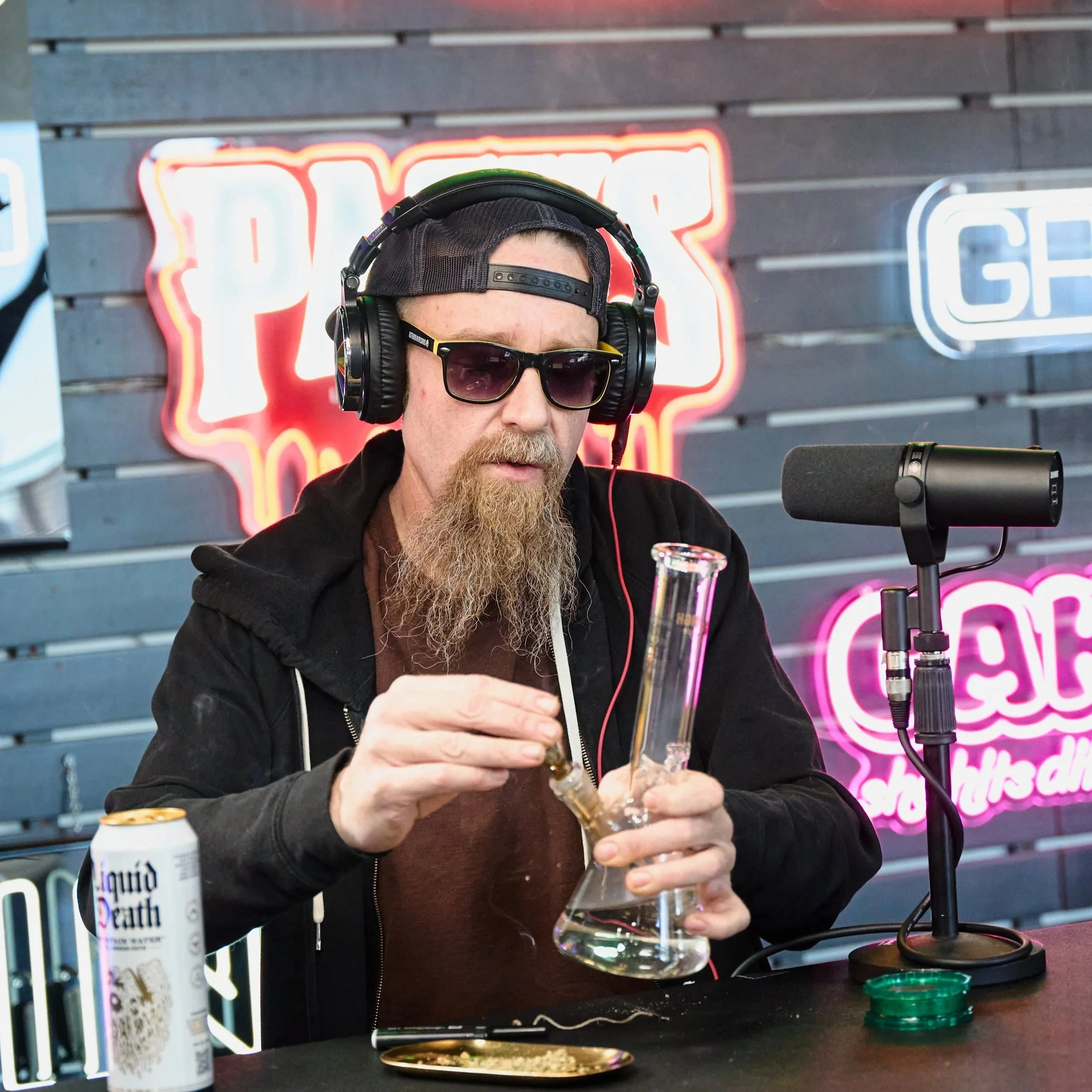 Cody Leavitt of Asteroid M Records preparing a bong during NuWu Sessions Podcast at Sky High Lounge in Las Vegas.