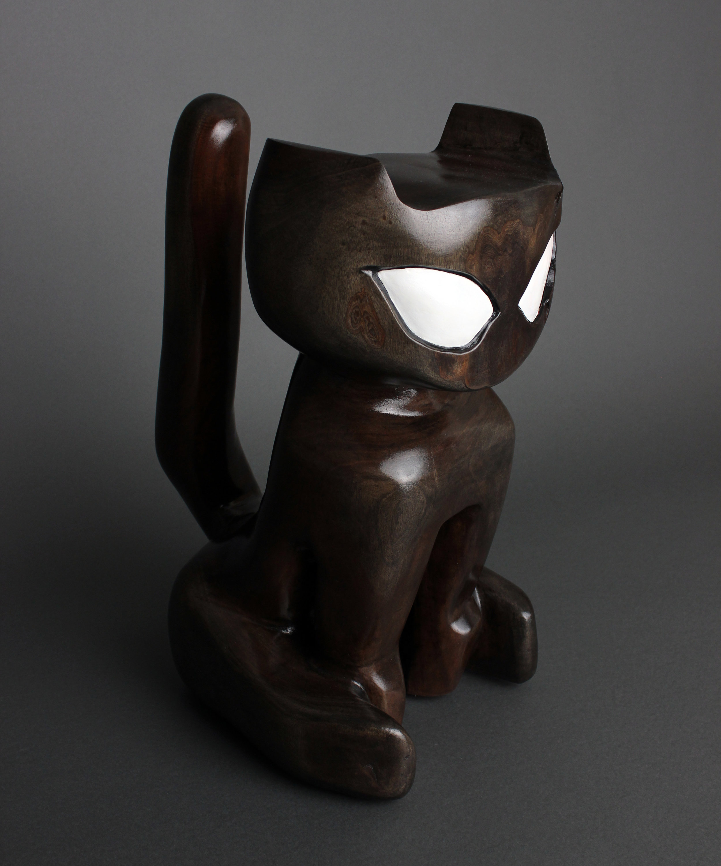   Cat Idol  reductive sculpture using a single block of mahogany harvested from my front yard. 2019 photo by   Alissa Deluca    exhibited -  Bailey Contemporary Arts during Pages From The Big Book 2022;   The Cultural Council for Palm Beach County du