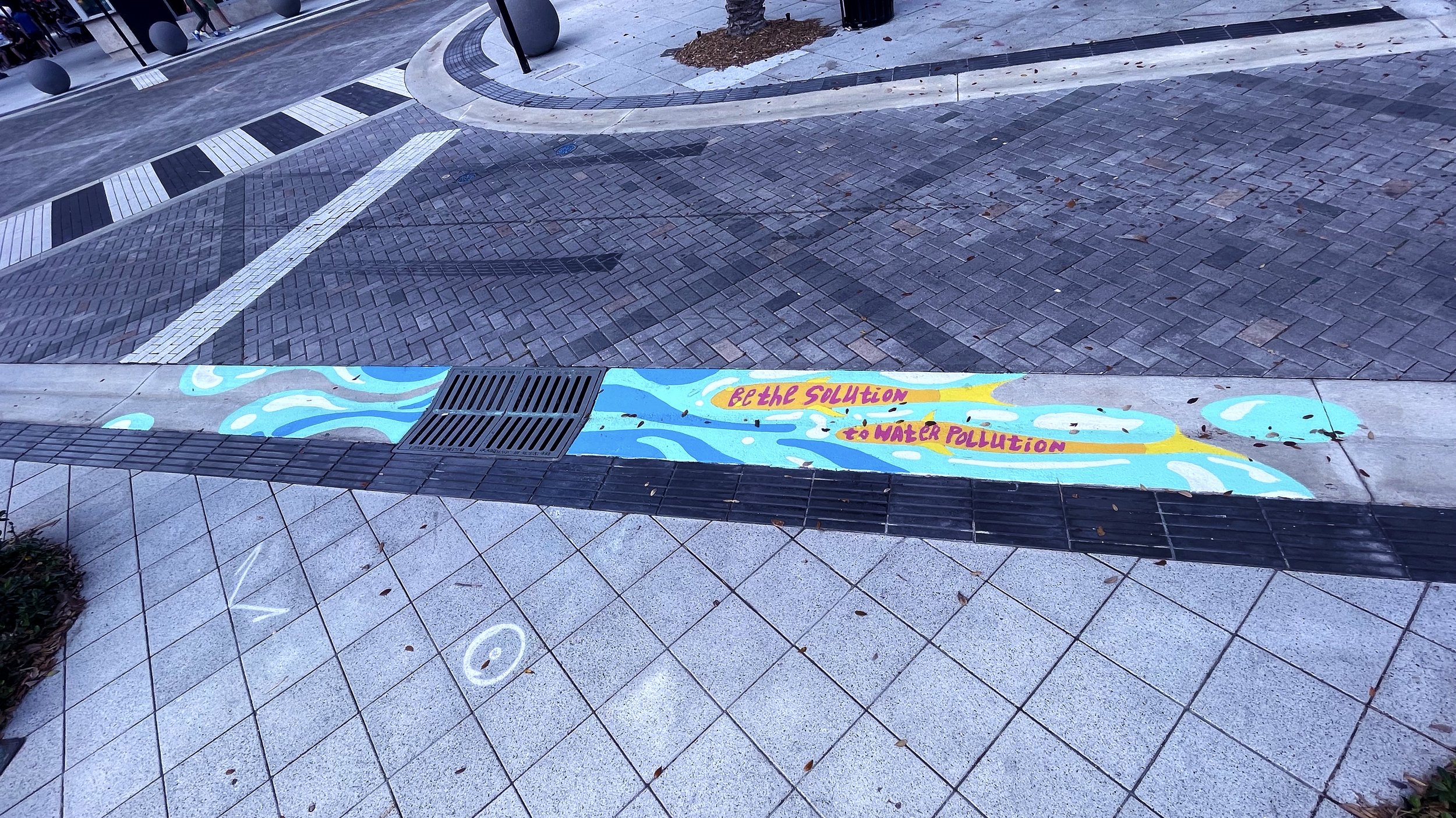  Agua De Vida  acrylic on concrete. 2022    one of twenty storm drain murals commissioned by The City of West Palm Beach Public Art Collection, ArtLife WPB. downtown Clematis St / N Flagler Dr, West Palm Beach, FL, 33401   