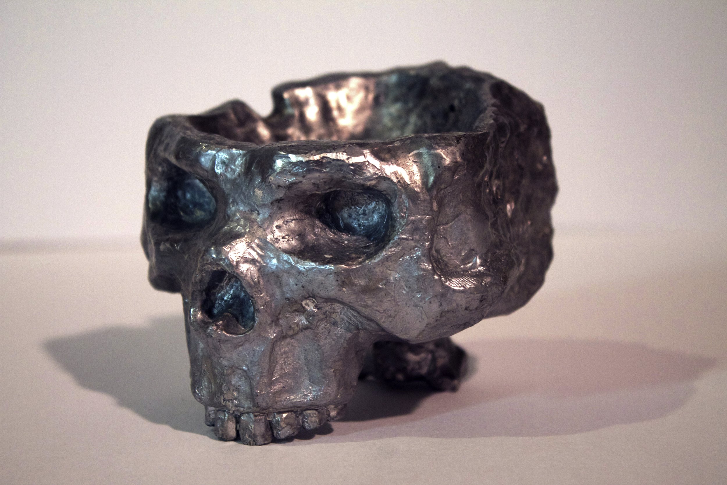   Metal Skull Ashtray  aluminum lost wax cast. 2008  exhibited -  Bailey Contemporary Arts during Anything And Everything From The Past 2022; Mac B. Sarasota FL 2008  
