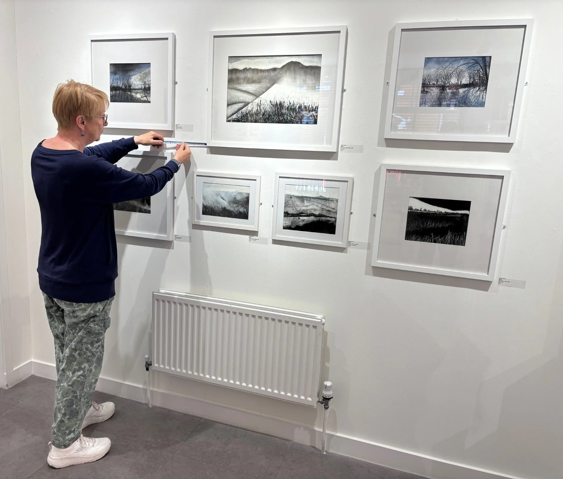 cme with charcoal wall and measuring between art.jpg