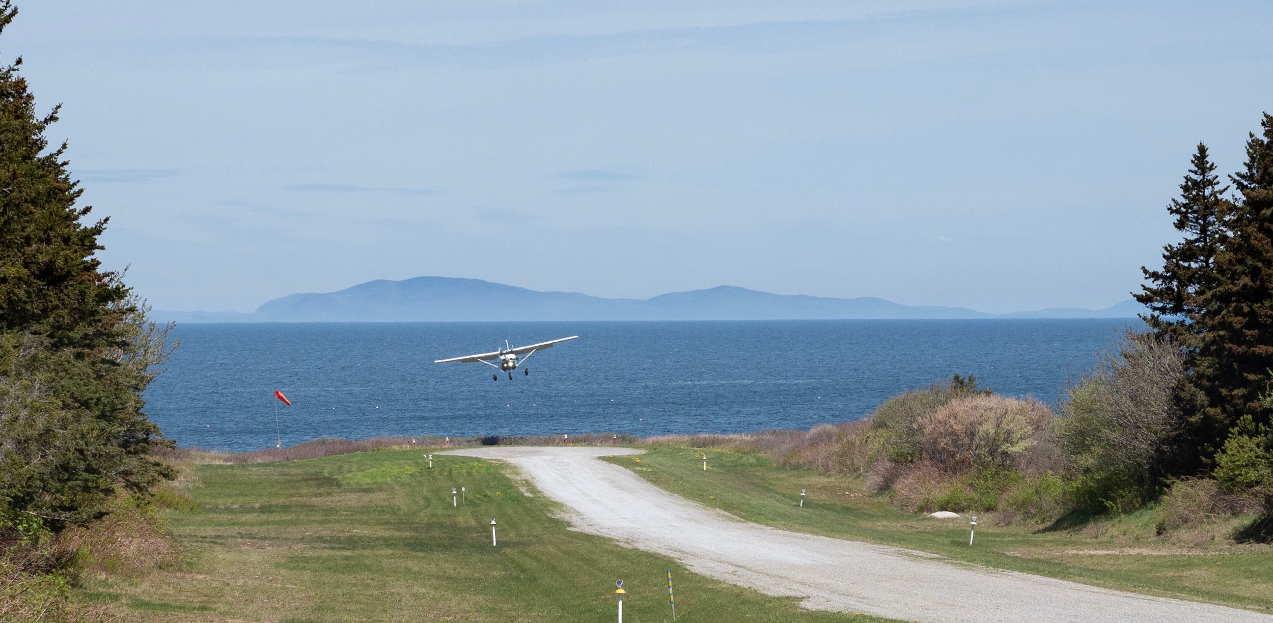 Matinicus’ gravel airstrip with the Camden Hills in the background