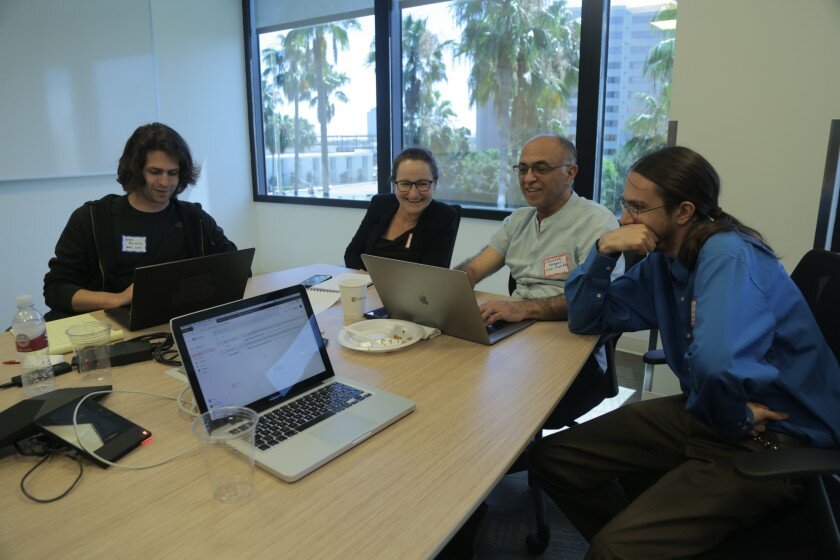   2019 Opera Hack-winning members of the Becoming team (left to right): John Burnette, Francesca Talenti, Shahrokh Yagdegari and Louis Pisha collaborate on their winning project, July 27-28, 2019. Photo: Angel Mannion  