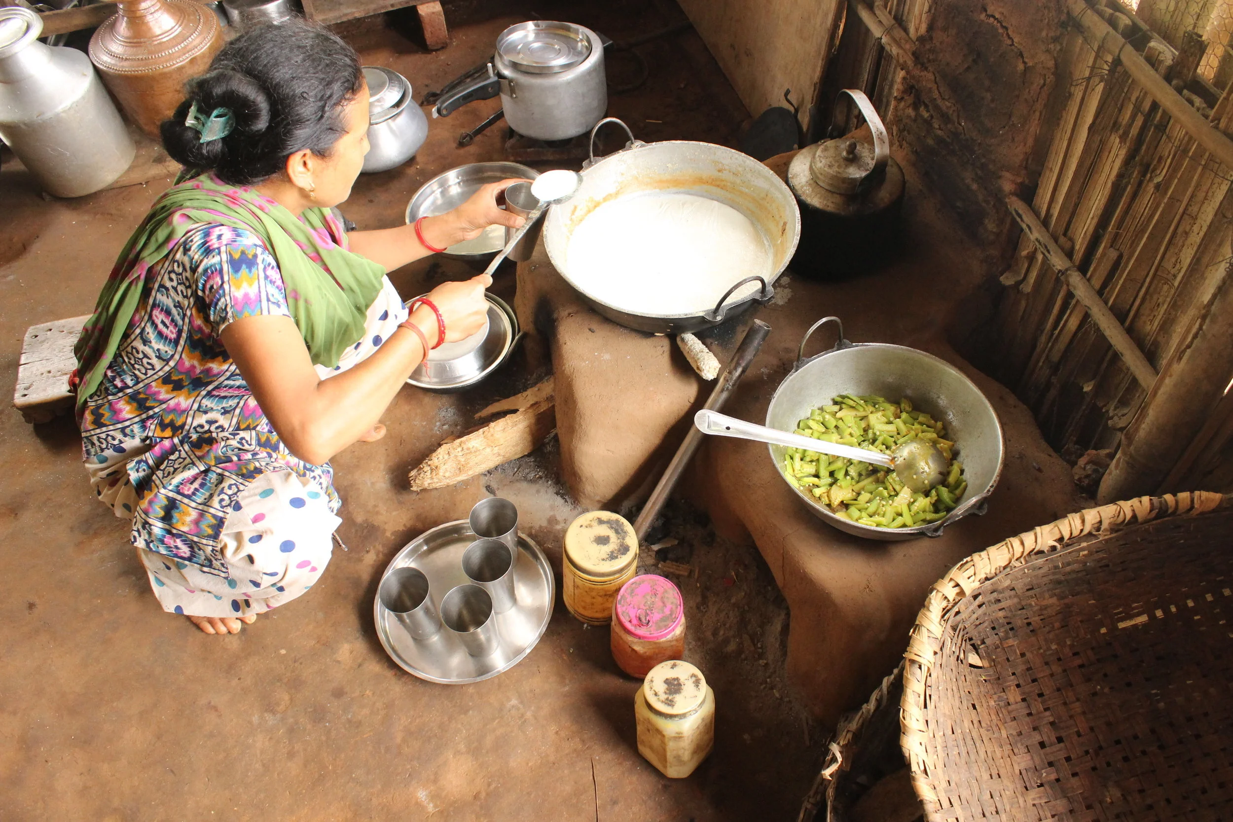 A woman cooking a meal to share with us, in a small Nepali village which had been devastated by the 2015 earthquake