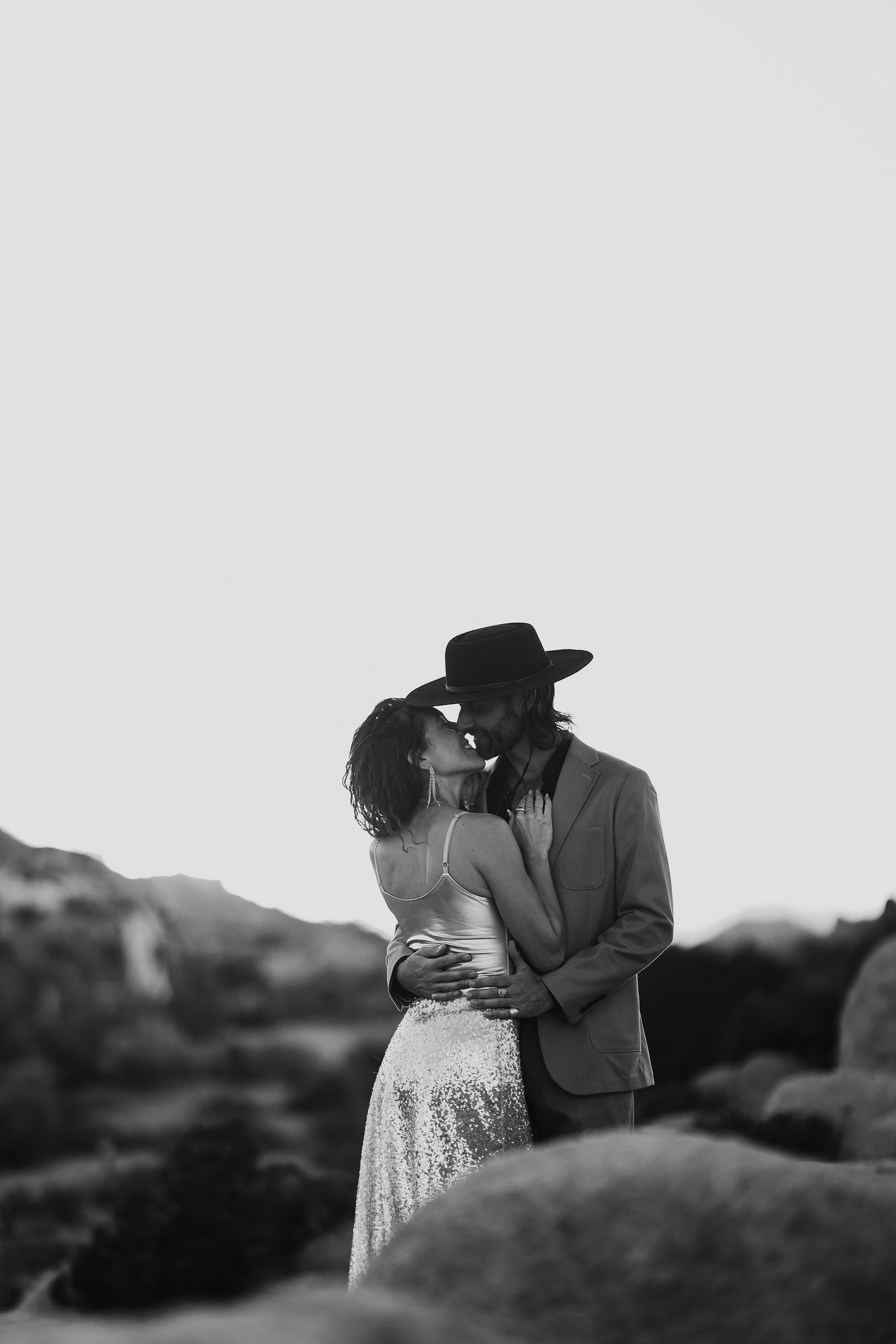 black and white engagement couple shoot kiss