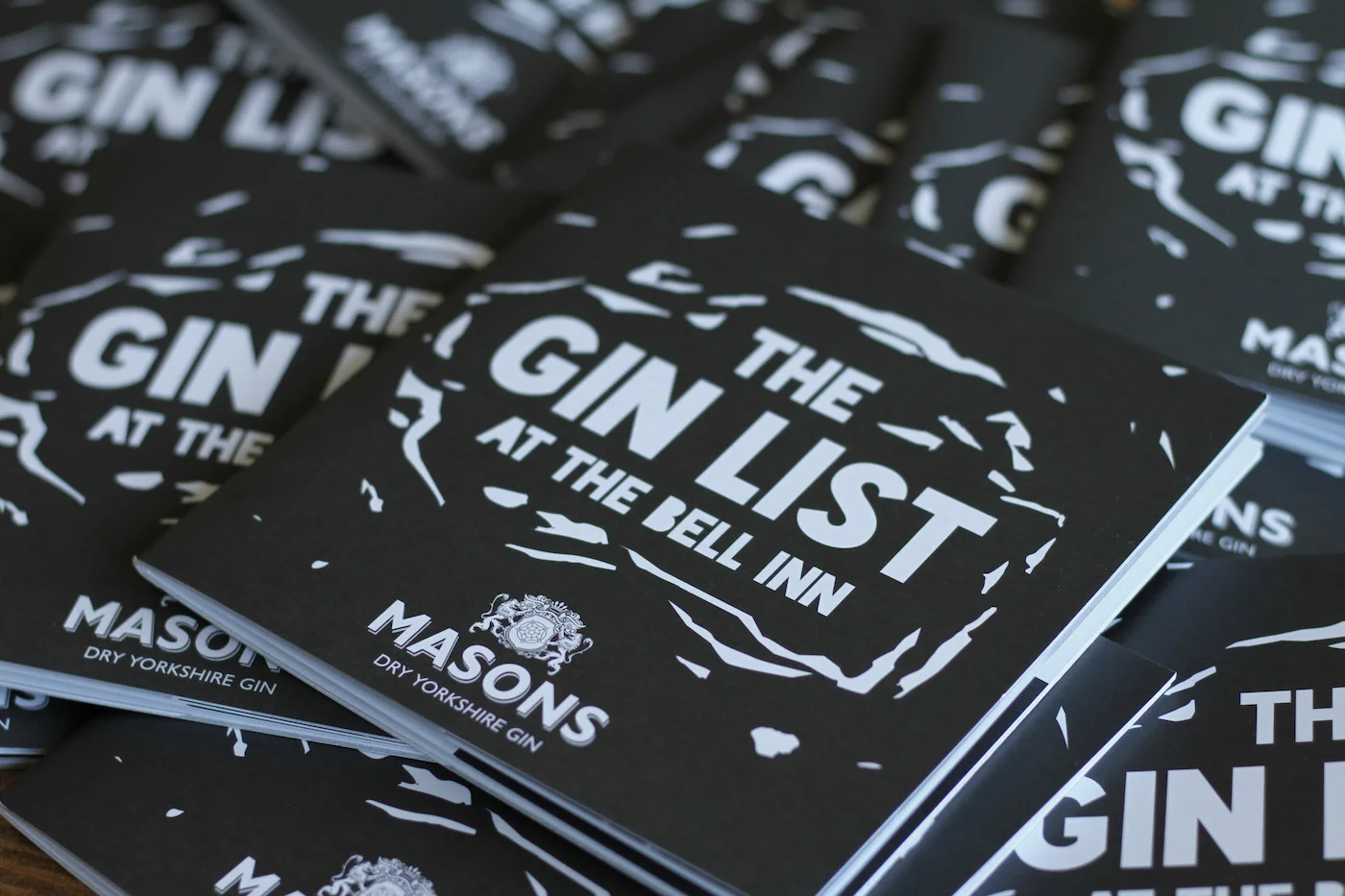 This booklet was made exclusively for the The Bell Inn and sponsored by Masons Dry Yorkshire Gin. It was designed with a striking black and white checkerboard theme, each bottle was individually illustrated in a linocut style. The booklet comprises a fascinating twenty pages of gins and gin tips.