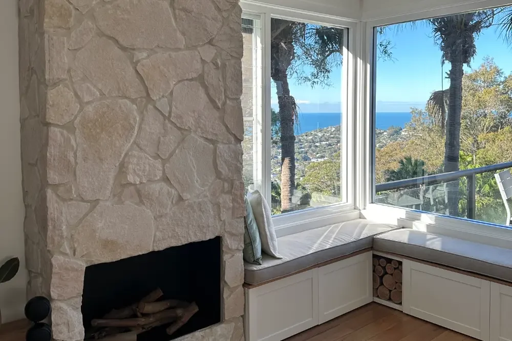 View from living room over the suburbs and to the ocean