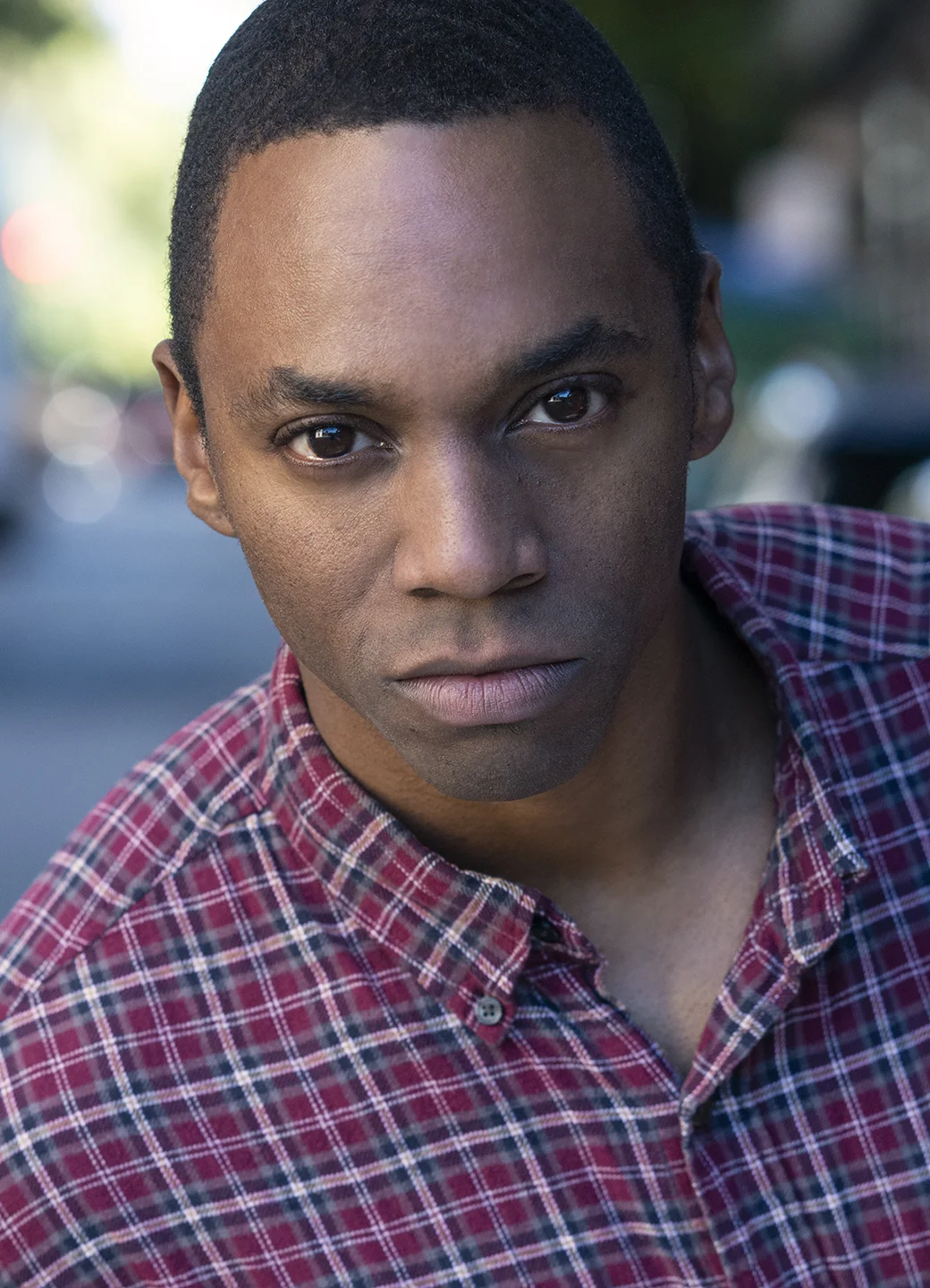 Malcolm Headshot Flannel Low Res.jpg