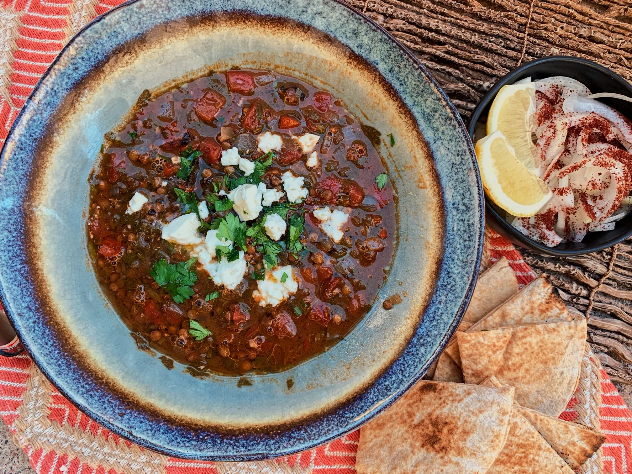 Serve with extra lemons, fresh pita, and sumac dusted onions