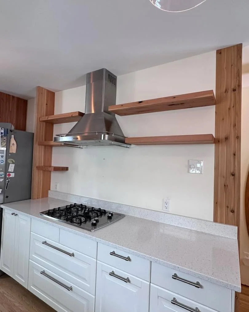 New shelving for some great clients we always enjoy working with.

Built from reclaimed fir from their own home, so it carries a bit of history with it. The side panel helps define the fridge while still keeping things open, and gives the shelves a c