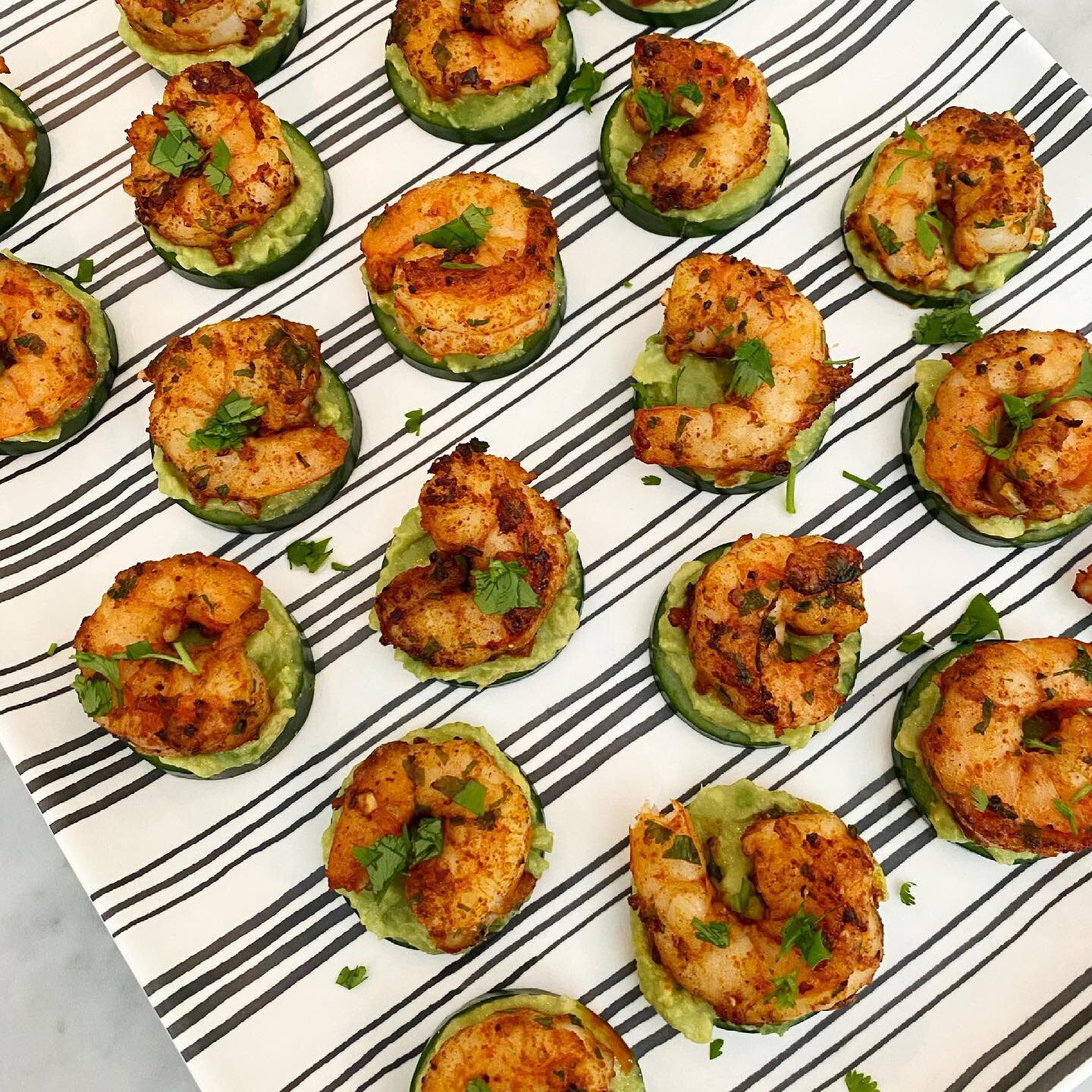 My simple, healthy, delish app that I brought to a 4th bbq: slices of cucumber get a thin layer of avocado mashed with lime and salt and are topped with shrimp saut&eacute;ed in olive oil and spiced with paprika, cayenne and cilantro. SO GOOD

#party