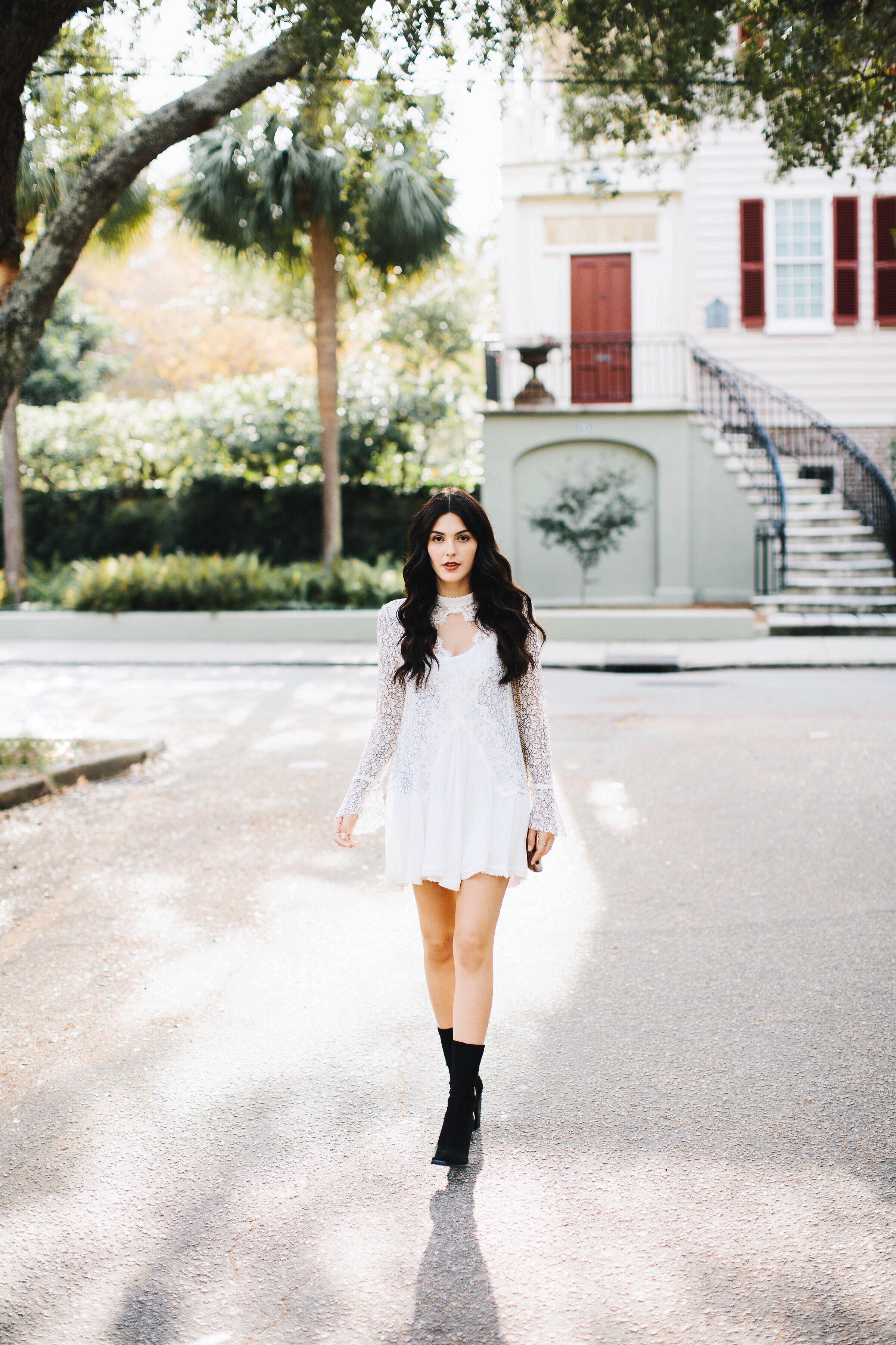 Julia Friedman wearing a Free People Lace Dress with suede boots from Nordstrom in Charleston, South Carolina.