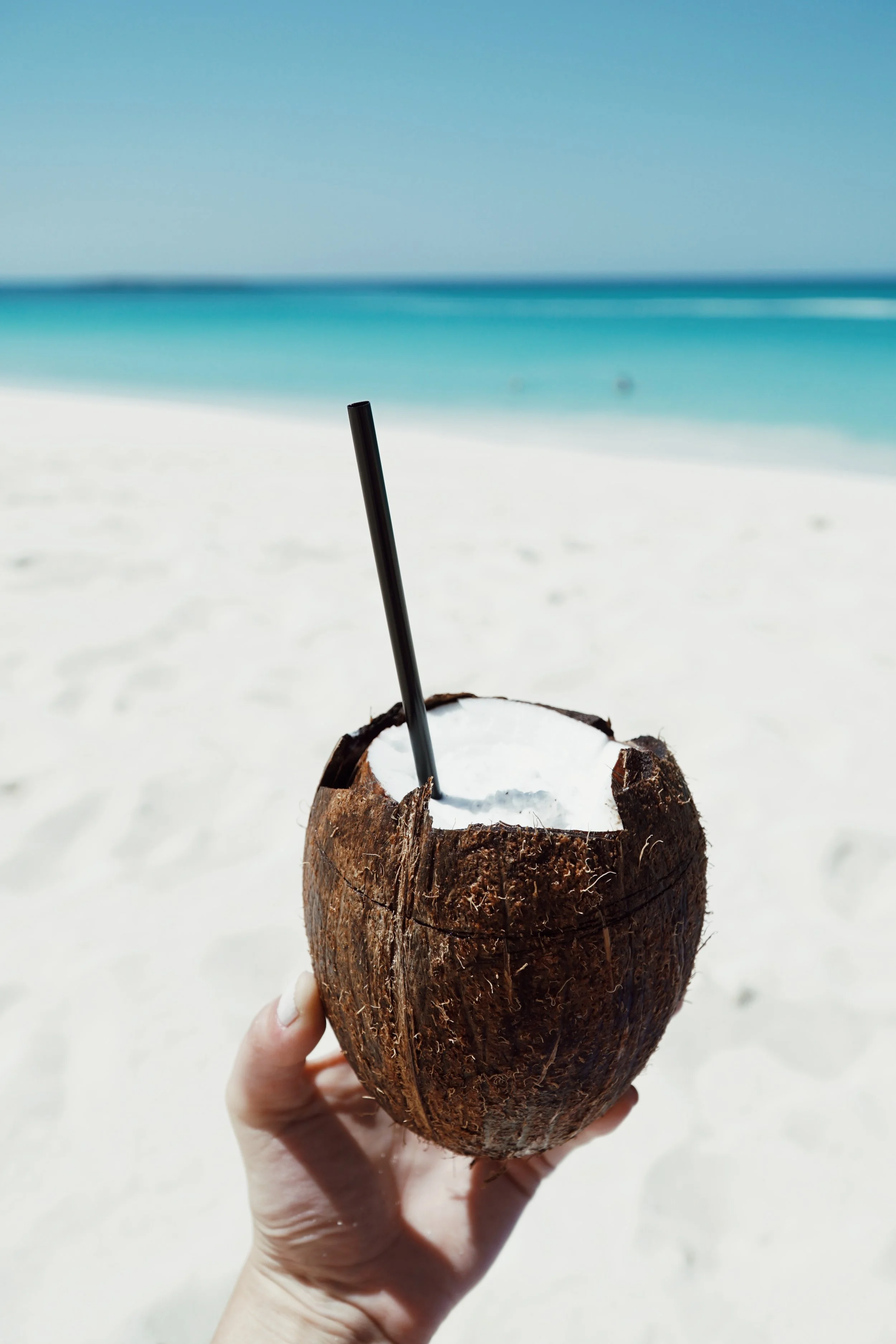 Julia Friedman enjoys a coconut smoothie at the One&Only Ocean Club in the Bahamas.