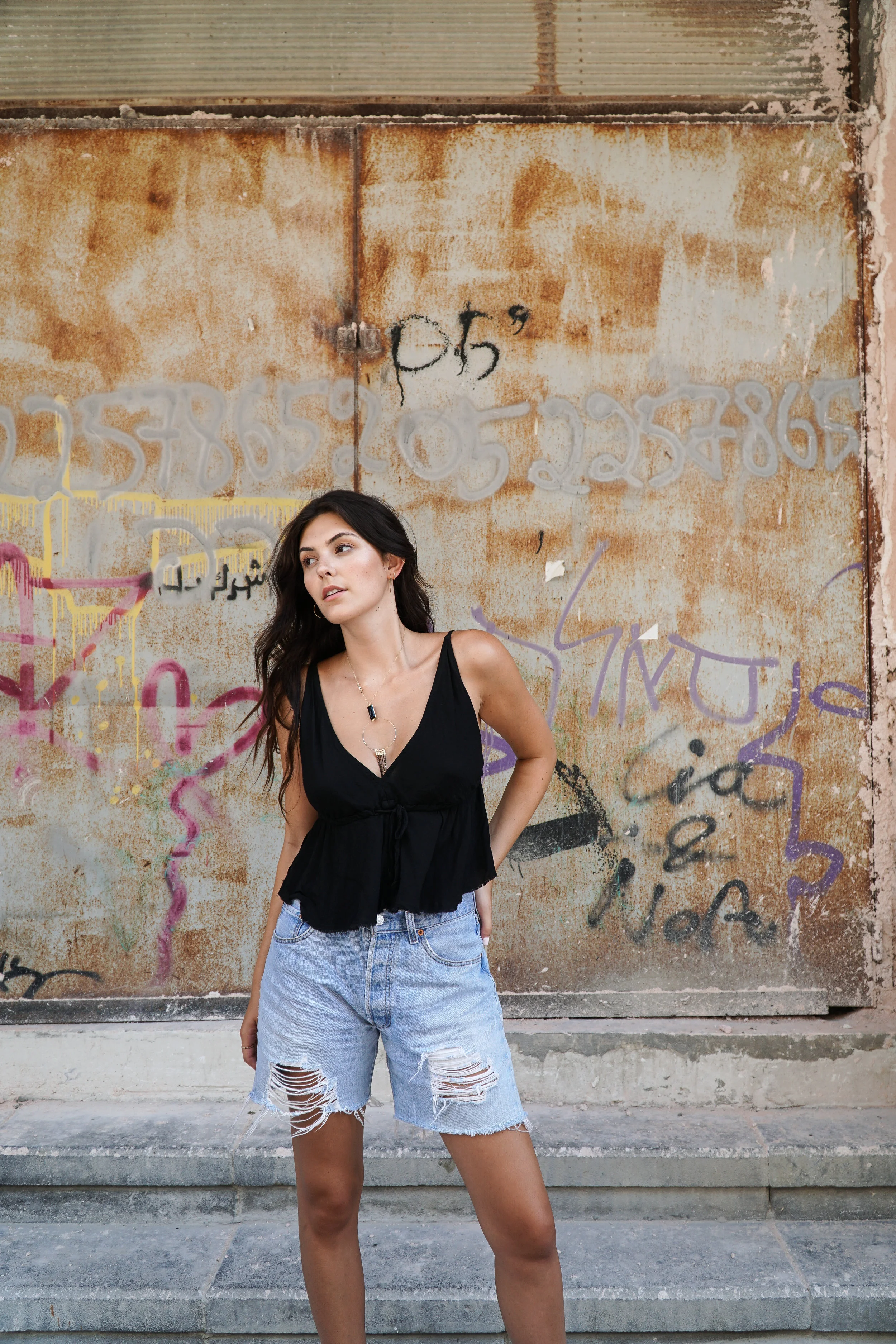 Julia Friedman wears a Brandy Melville Top with Levi's in Tel Aviv, Israel.