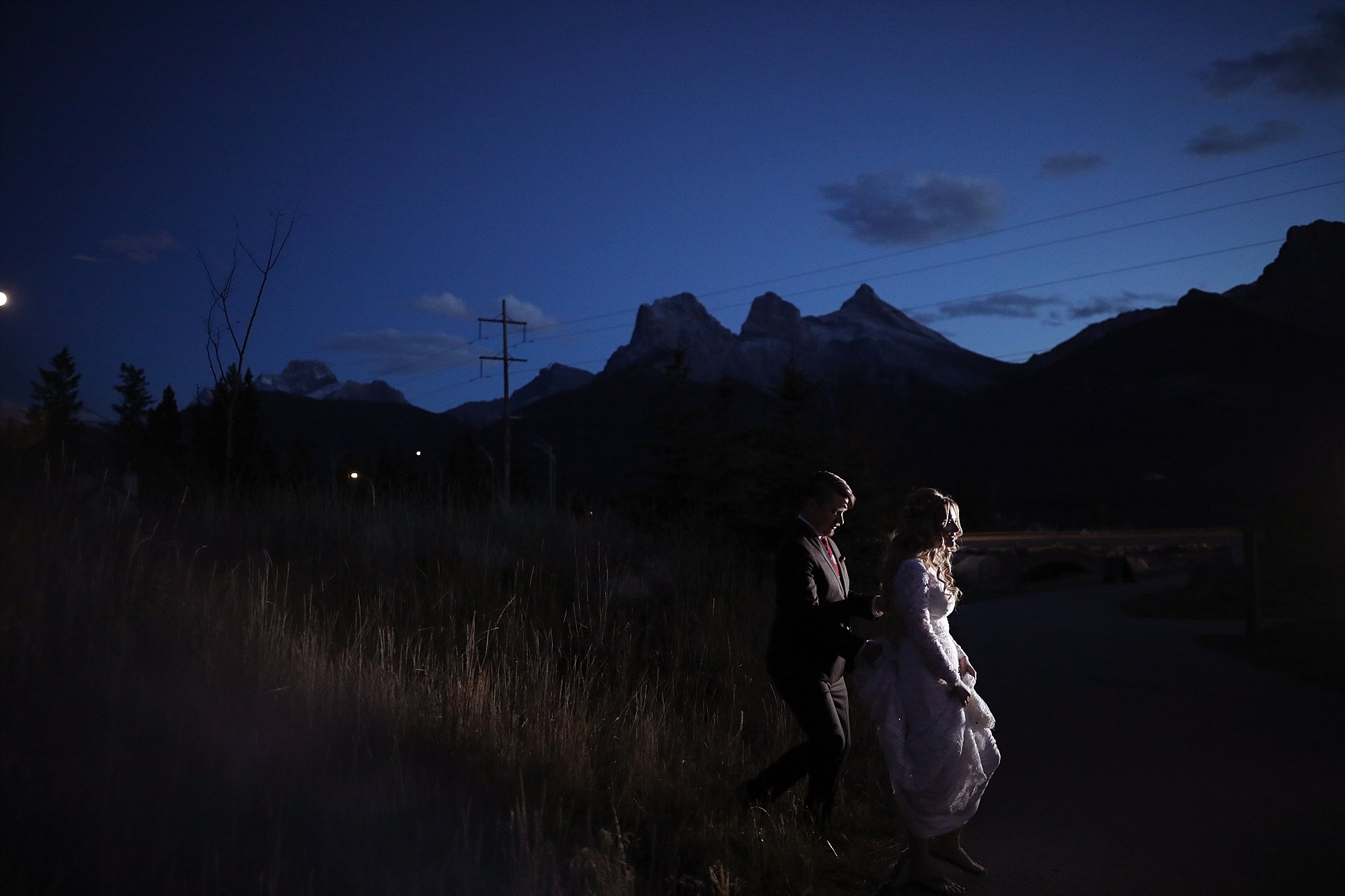 photo of a bride and groom at blue hour twilight on their wedding in canmore alberta