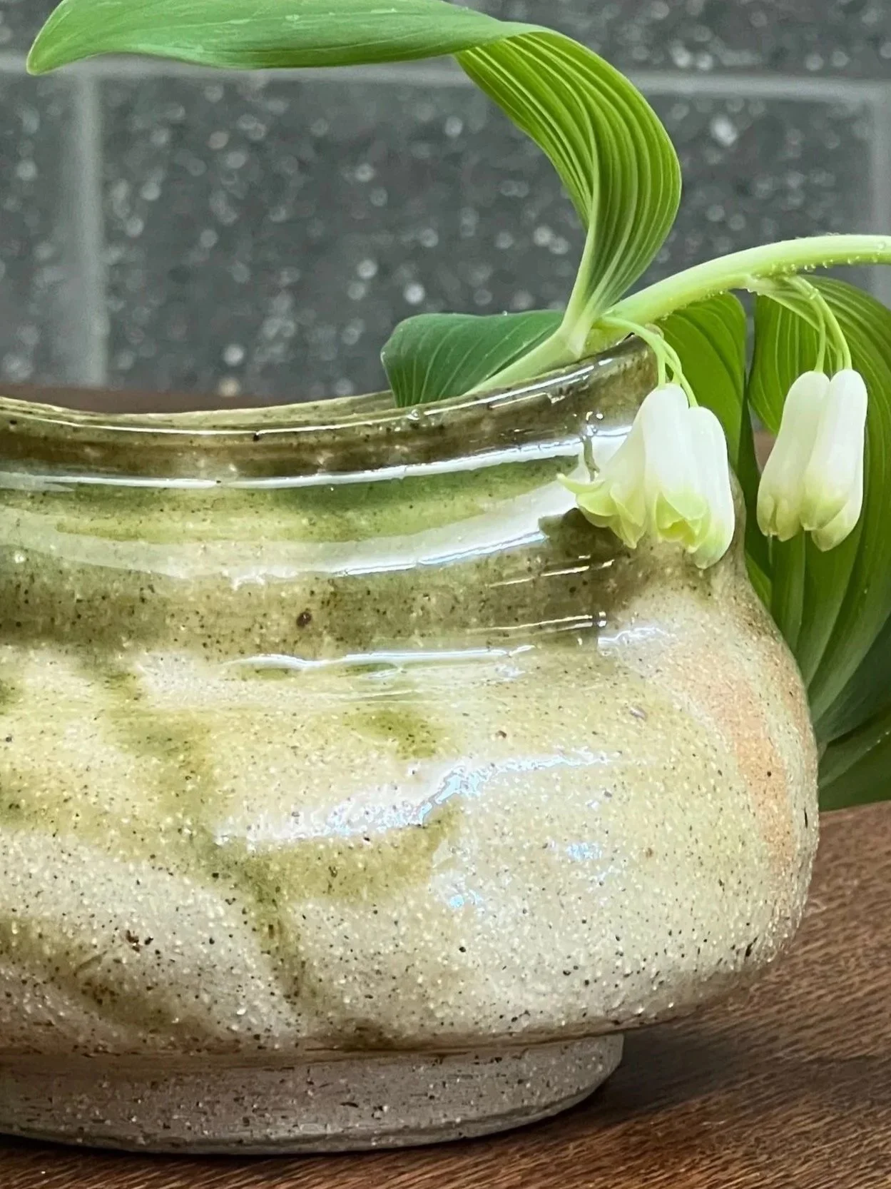 Vessel: Wheel-thrown and altered vase fired in oxidation - Oribe glaze (2023) Flower: Solomon's Seal  (Spring) 