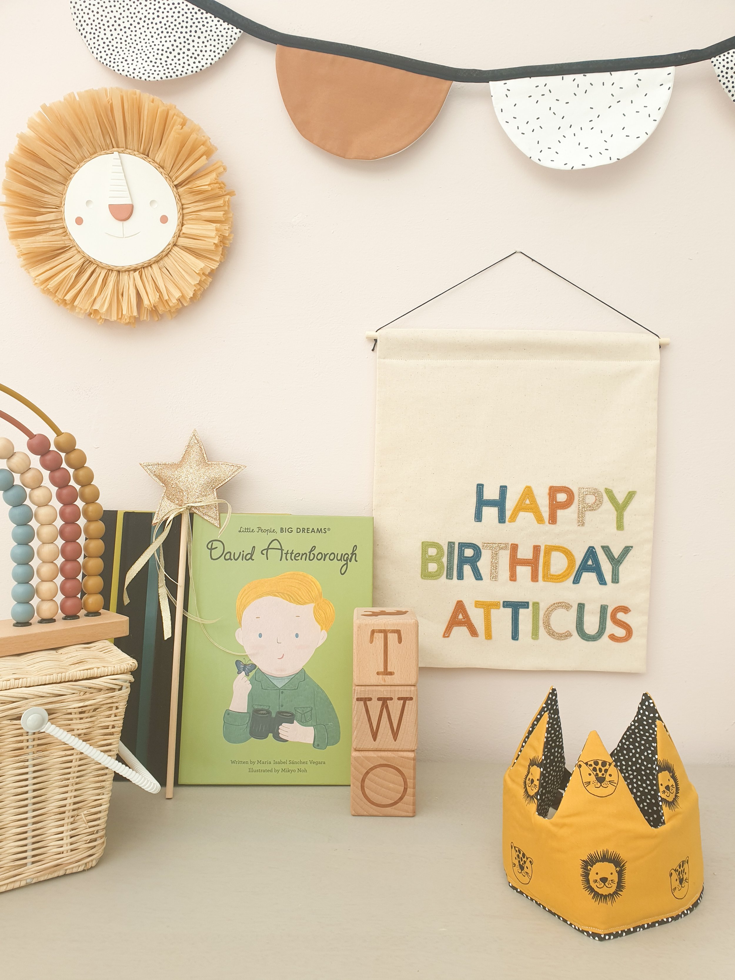 Handmade personalised banner hanging in children's playroom.