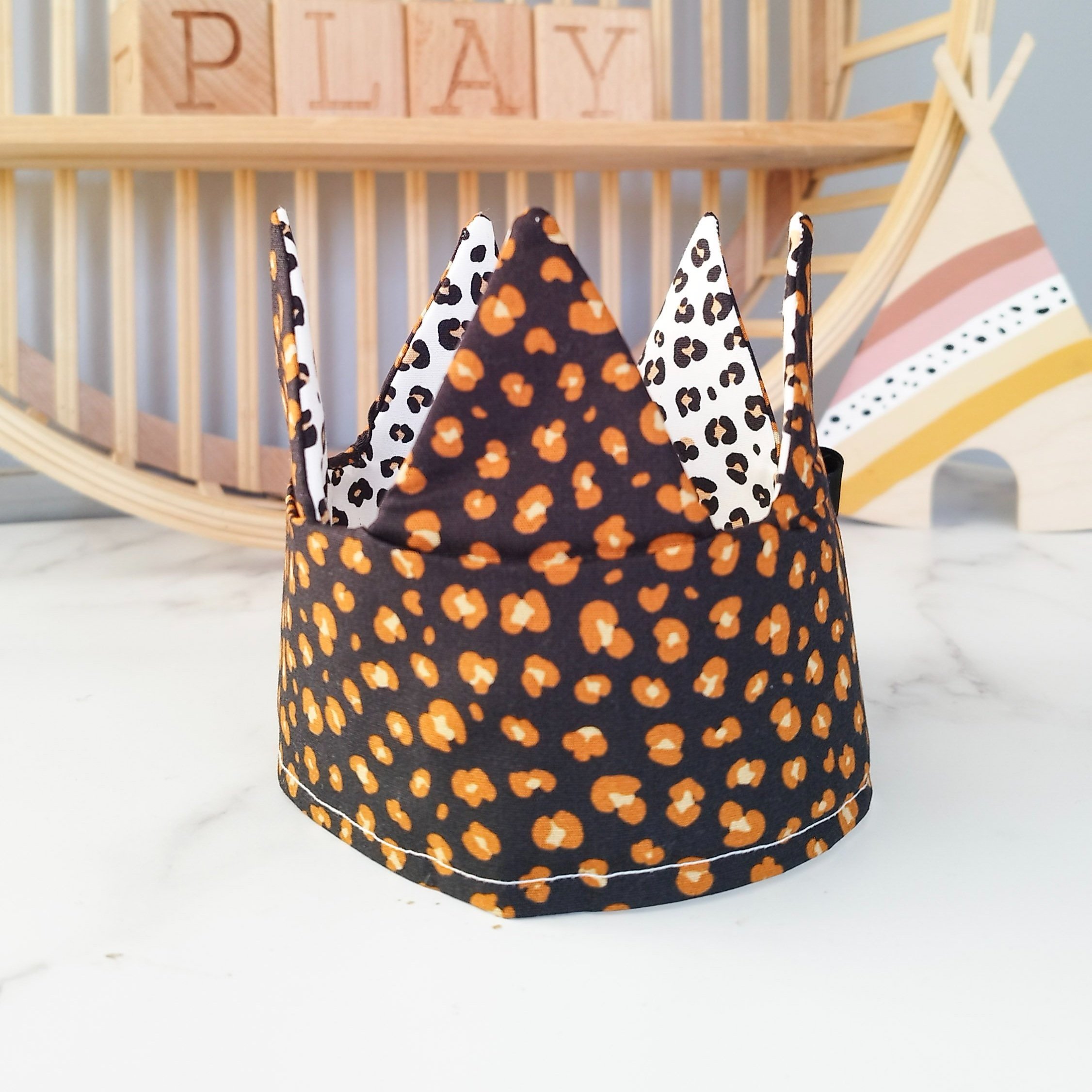 Reversible leopard print crown in a child's bedroom