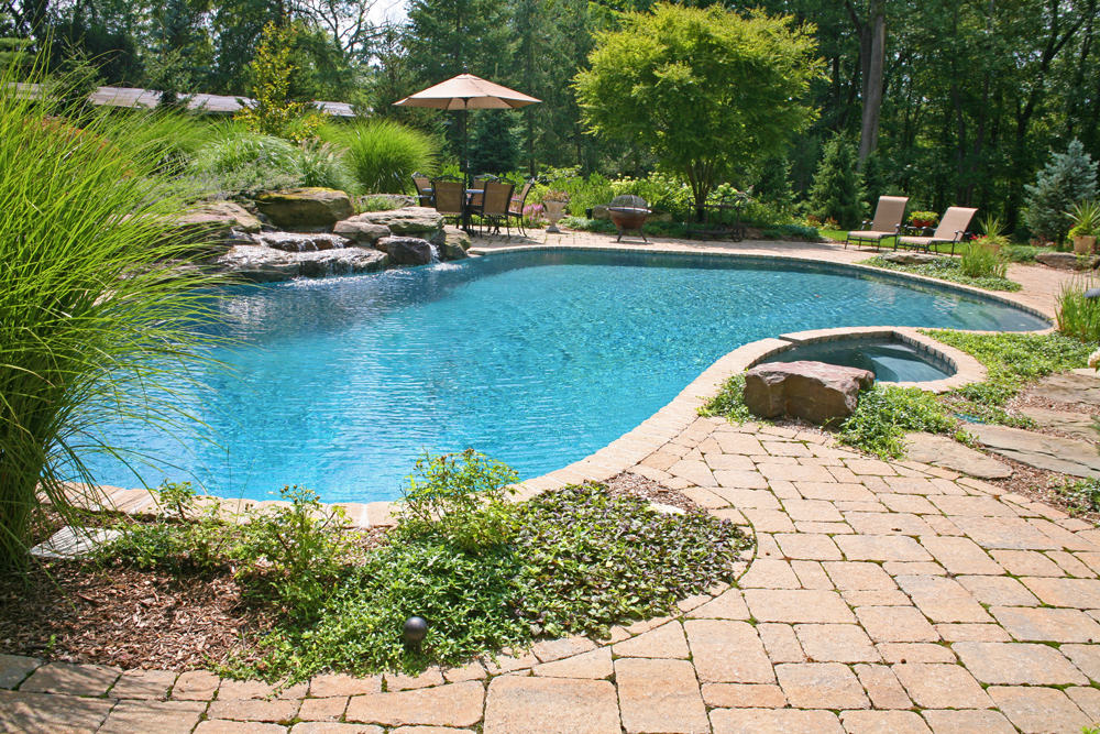 Landscape design with paver patio and inground pool in Franklin Lakes, NJ