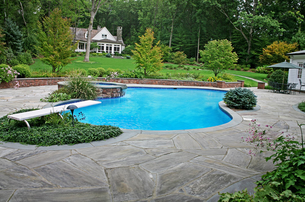 Paver patio, inground pool and outdoor kitchen in Saddle River, NJ