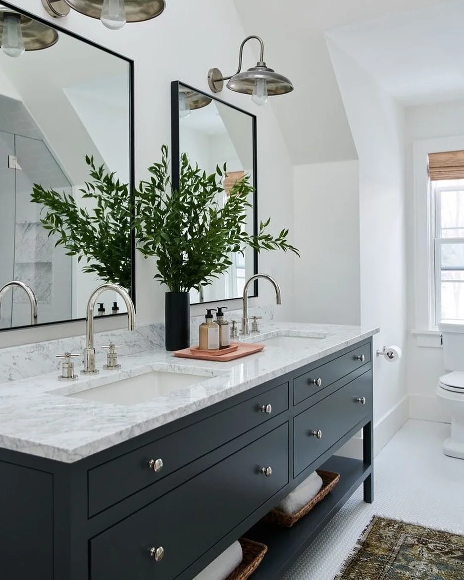 Those light fixtures add personality and a touch of costal to this beautiful bathroom. It&rsquo;s all in the details 🖤 
#homeredefined#rusticdecor#bathroomdesign#coastaldecor#bathroominspo#blackcabinets#fresh 
@all.sorts.of