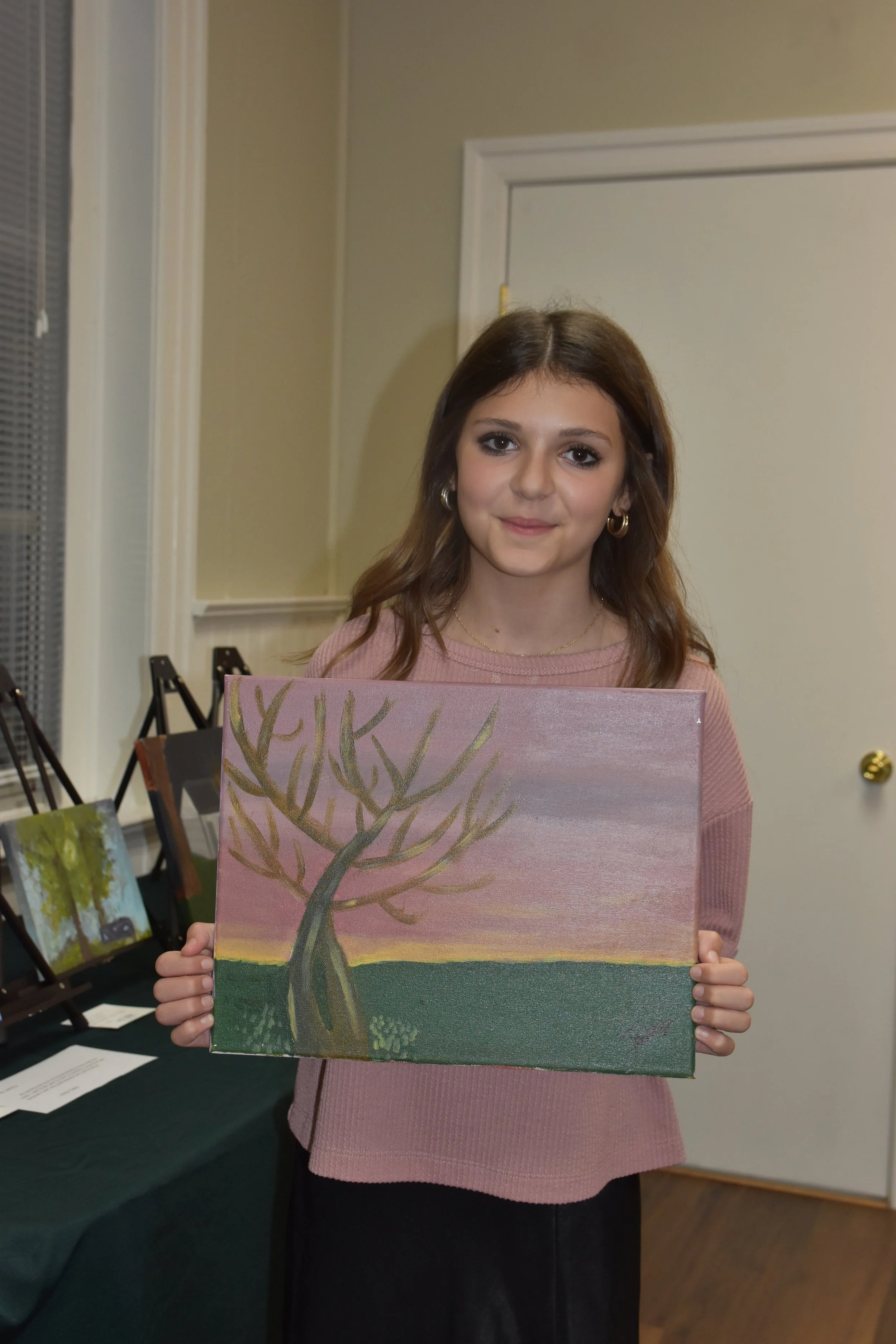 Jordyn Daley with her painting "Pale Woods"