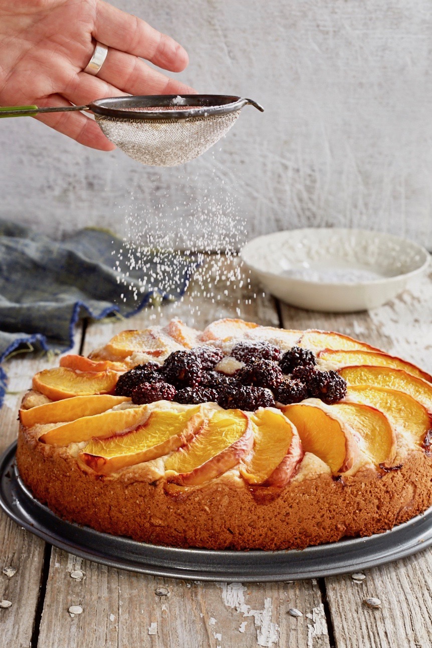 Upside Down Peach Cake with Powdered Sugar Dusting