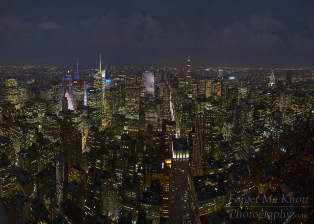 Above Manhattan, New York city skyline night buildings lights